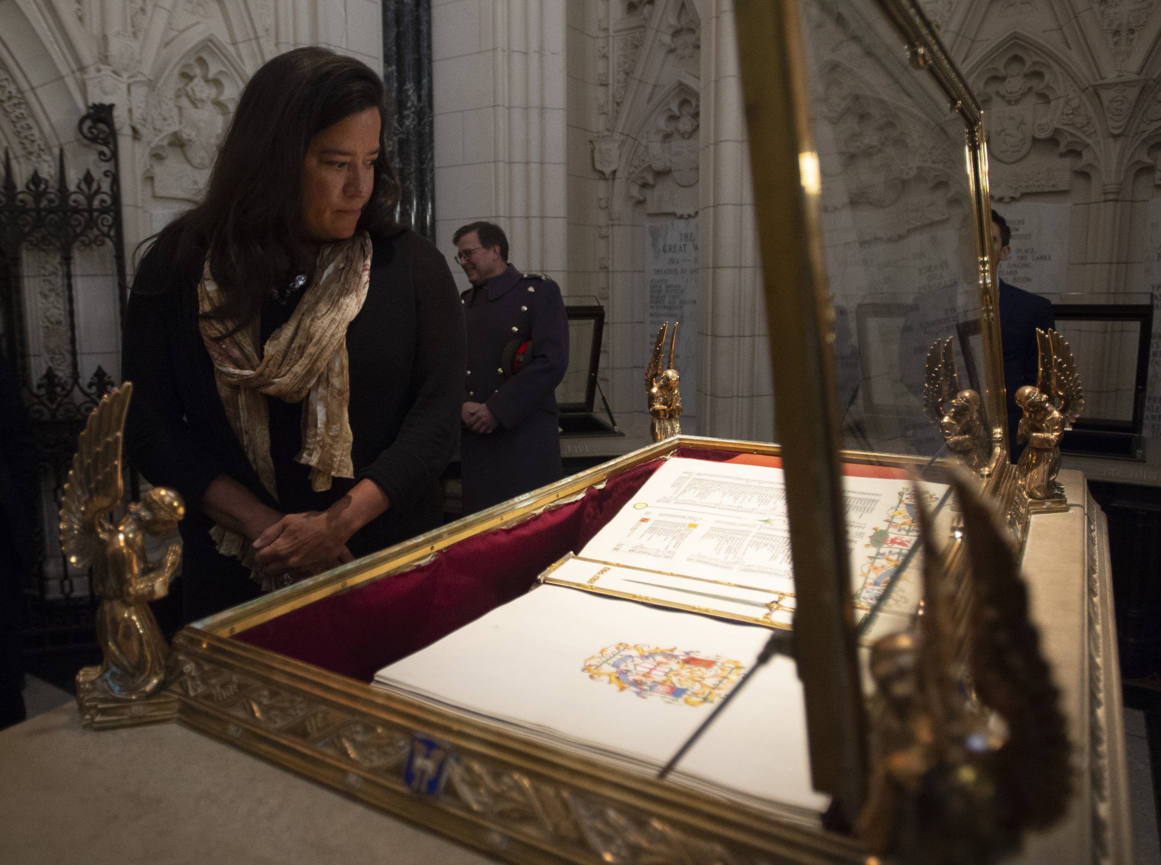 Veterans Affairs Minister Jody Wilson-Raybould views the the World War I Book of Remembrance before a ceremony closing the Memorial Chamber in Centre block on Parliament Hill in Ottawa, Monday February 4, 2019. (Adrian Wyld/CP)