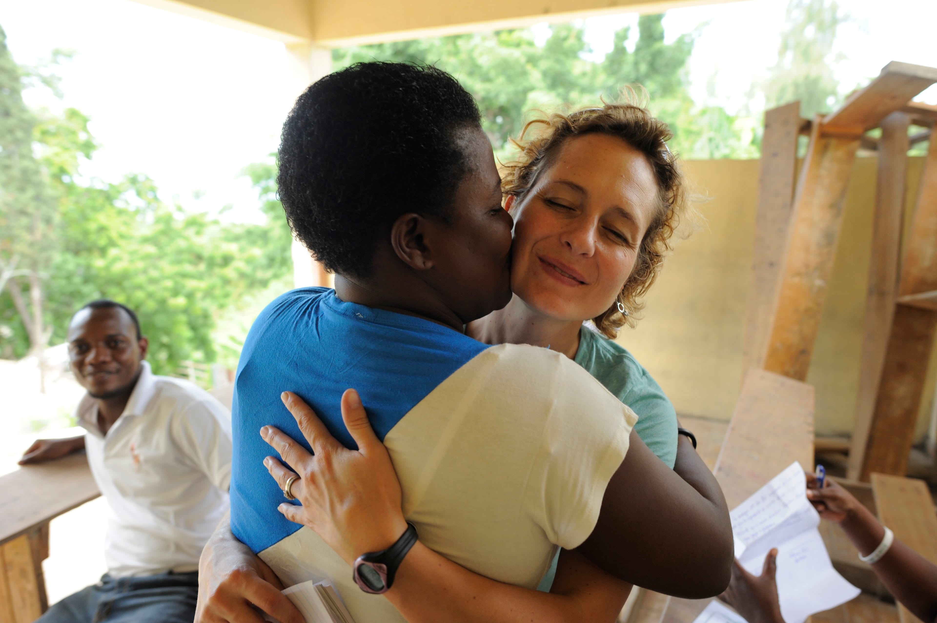 Catherine Porter is embraced by Roselene Derival Fabre after Porter donated money to her Port-au-Prince school. (Photo by Lucas Oleniuk/Toronto Star via Getty Images)