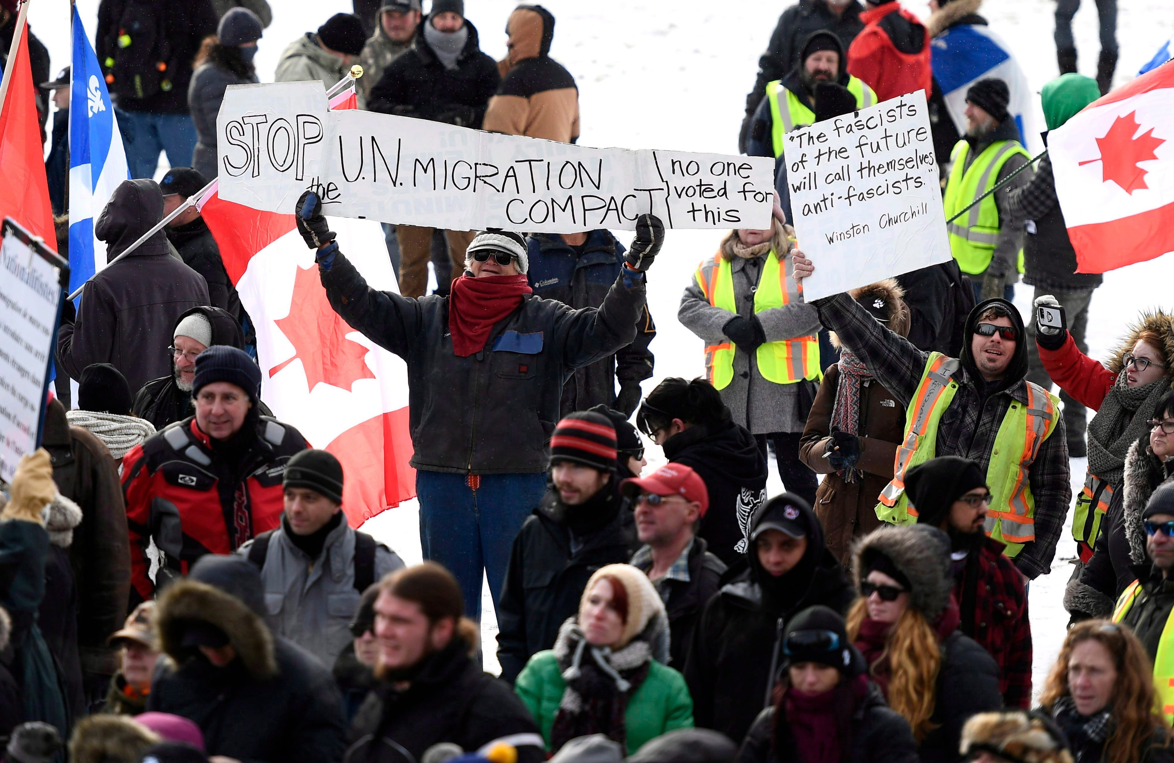People protest against the United Nations Global Compact for Safe, Orderly and Regular Migration on Parliament Hill in Ottawa on Saturday, Dec. 8, 2018. (Justin Tang/CP)