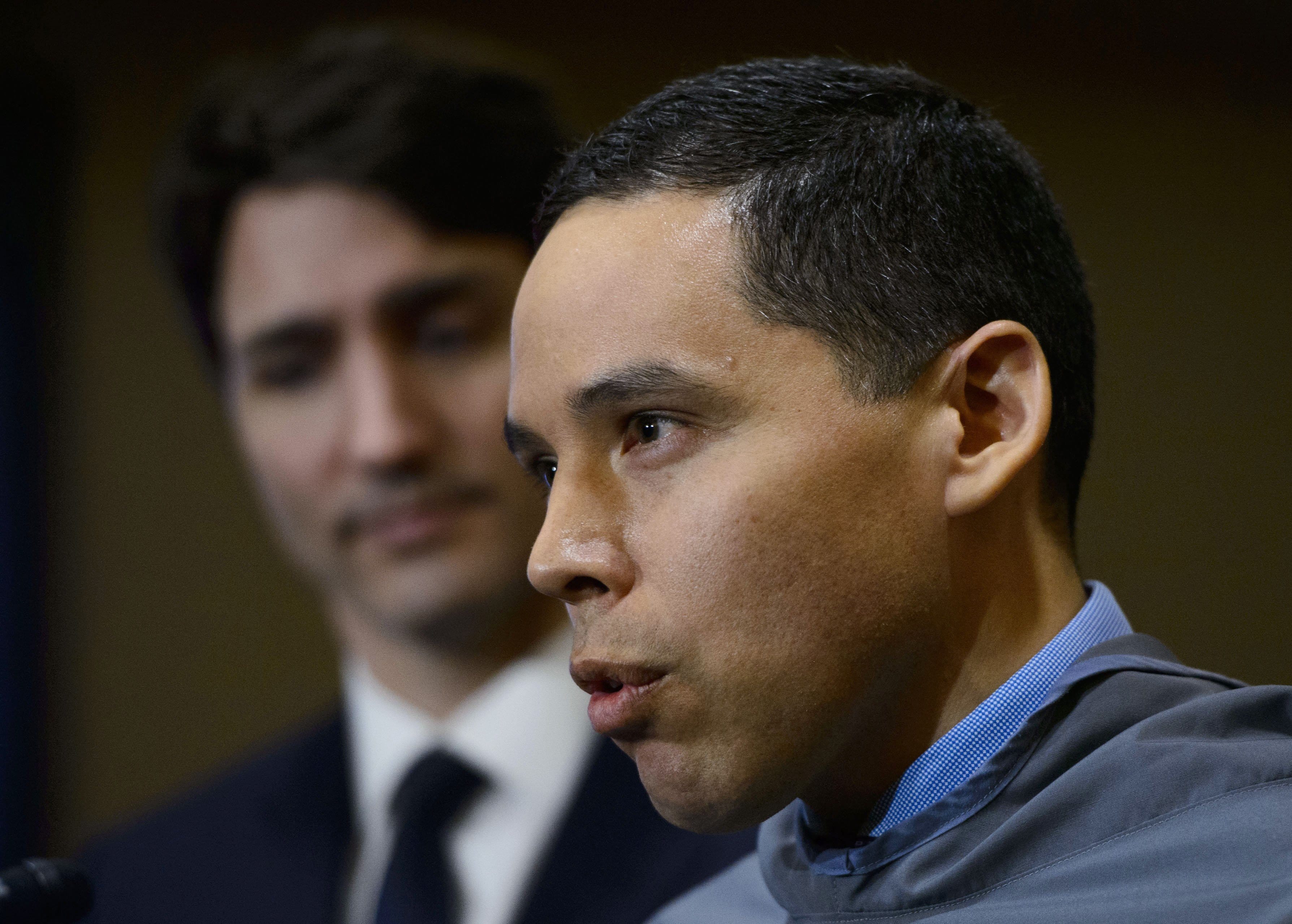 Prime Minister Justin Trudeau looks on as Natan Obed, President of the ITK, speaks during a press conference in Iqaluit, Nunavut on Friday, March 8, 2019. (THE CANADIAN PRESS/Sean Kilpatrick)
