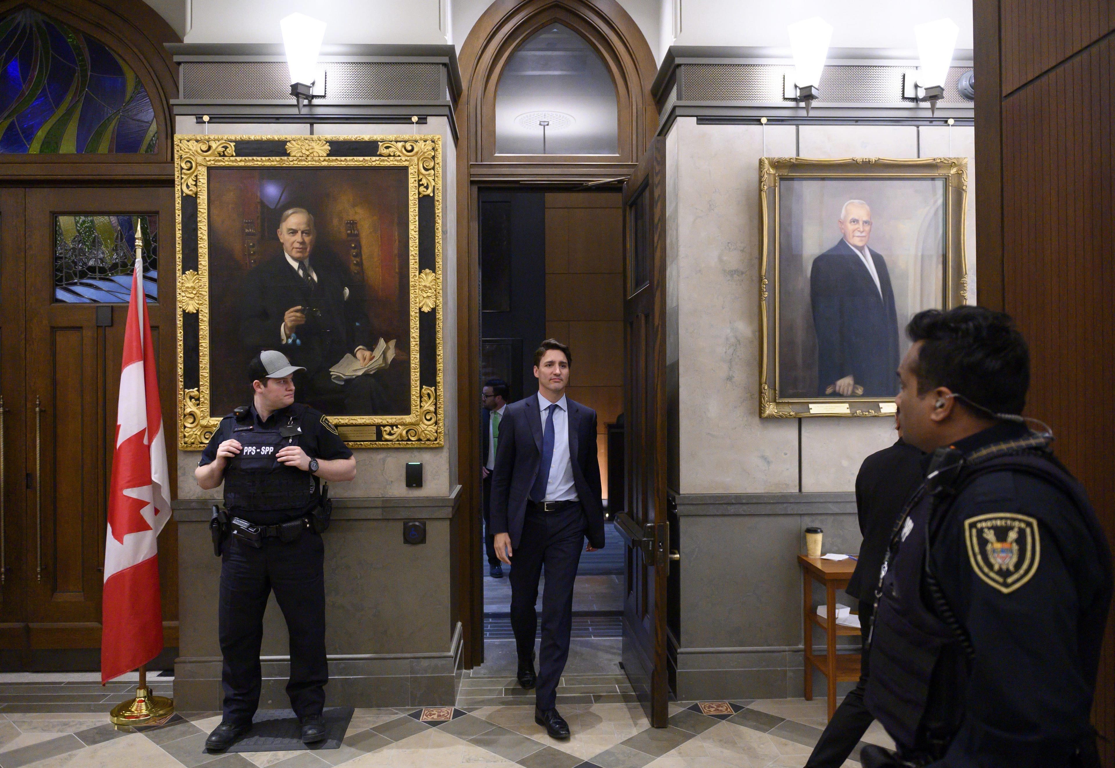 <span>Trudeau leaves the foyer of the House of Commons after participating in the second night of a marathon voting session on Parliament Hill on Thursday, March 21, 2019.</span> (Justin Tang/CP)
