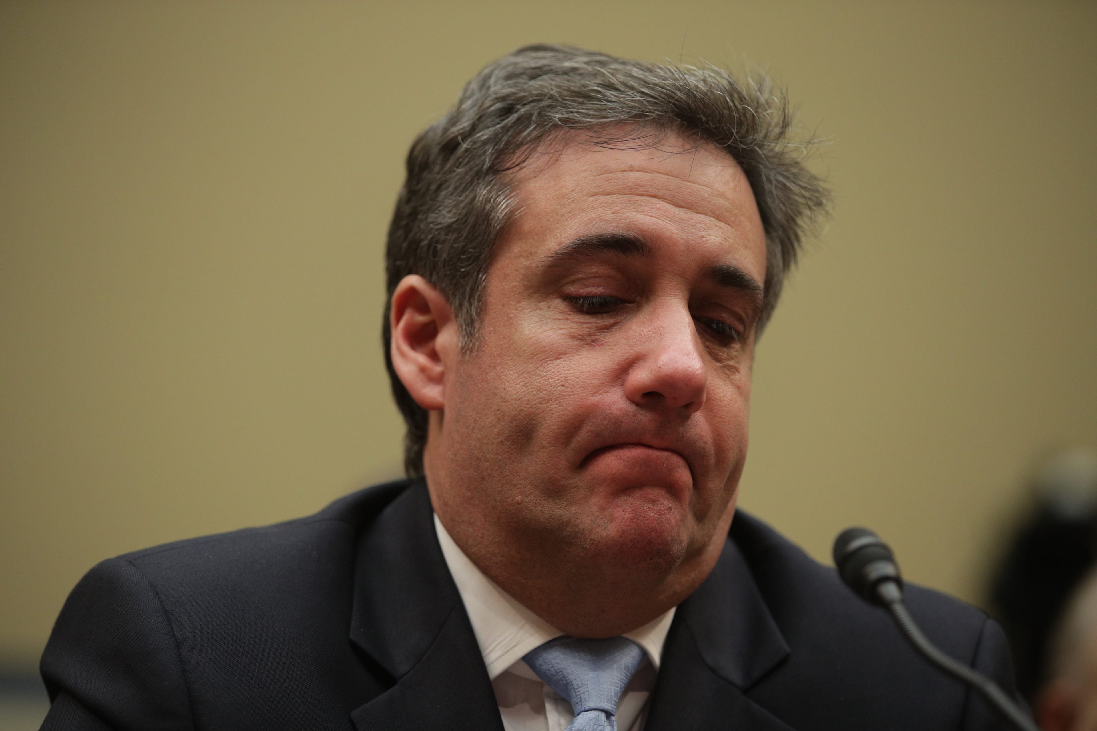 Michael Cohen, former attorney and fixer for President Donald Trump, gets emotional listening to Rep. Elijah Cummings (D-MD) give his closing statement after Cohen testified before the House Oversight Committee on Capitol Hill February 27, 2019 in Washington, D.C.  (Photo by Alex Wong/Getty Images)