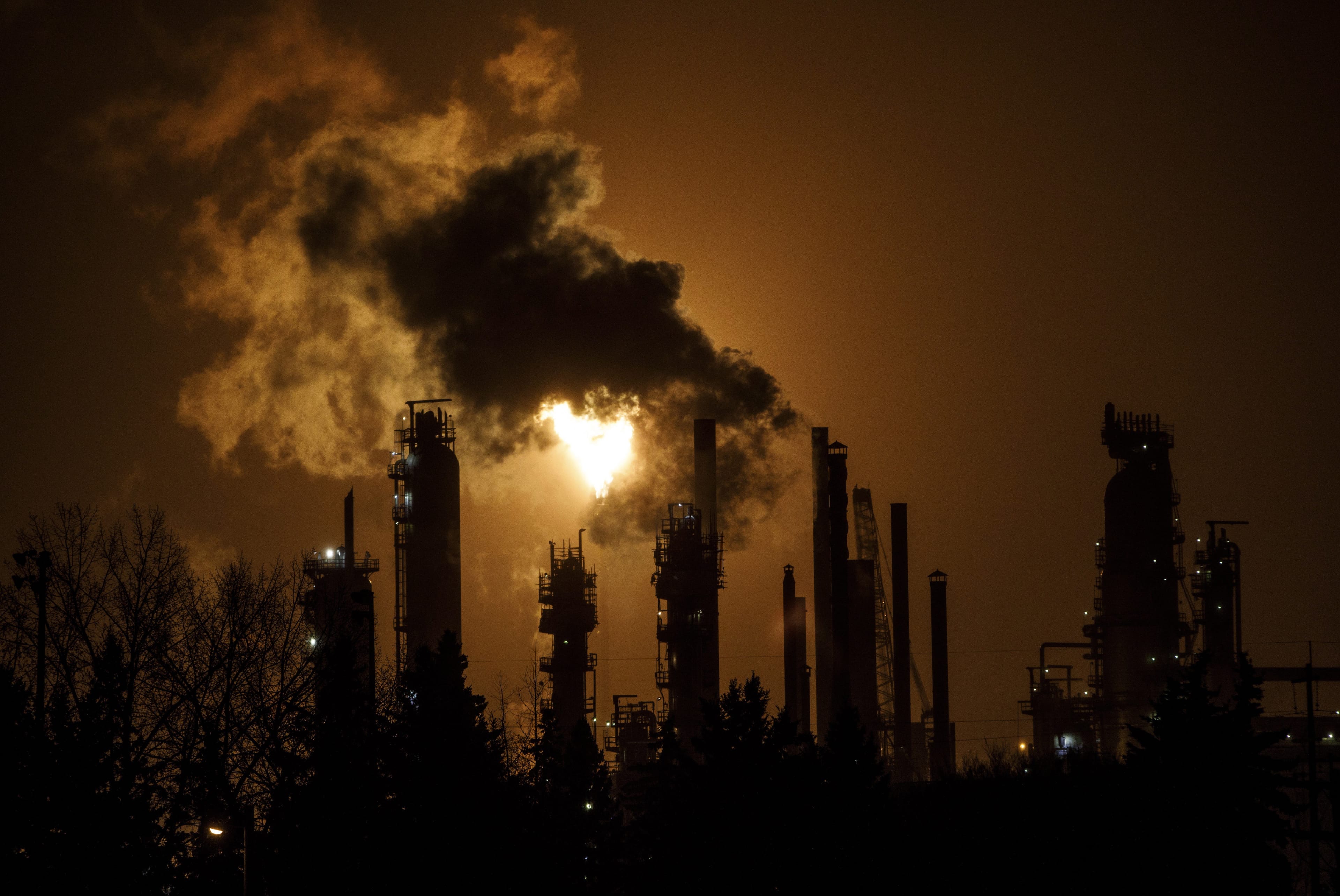 A flare stack lights the sky from the Imperial Oil refinery in Edmonton on December 28, 2018. (Jason Franson/CP)