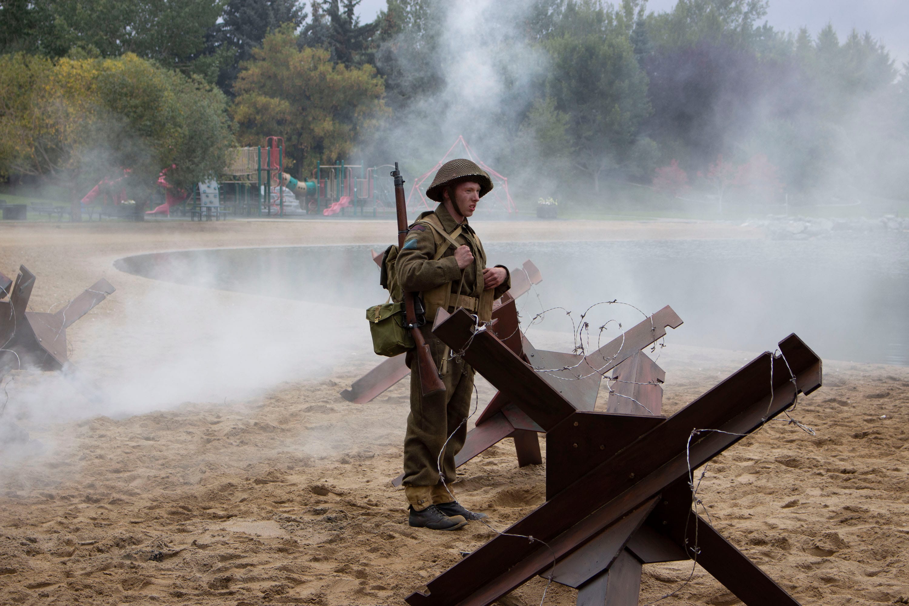 A young actor waits in the smoke in Calgary’s Heritage Park during the filming of Historica Canada’s Heritage Minute about D-Day (Historica Canada)