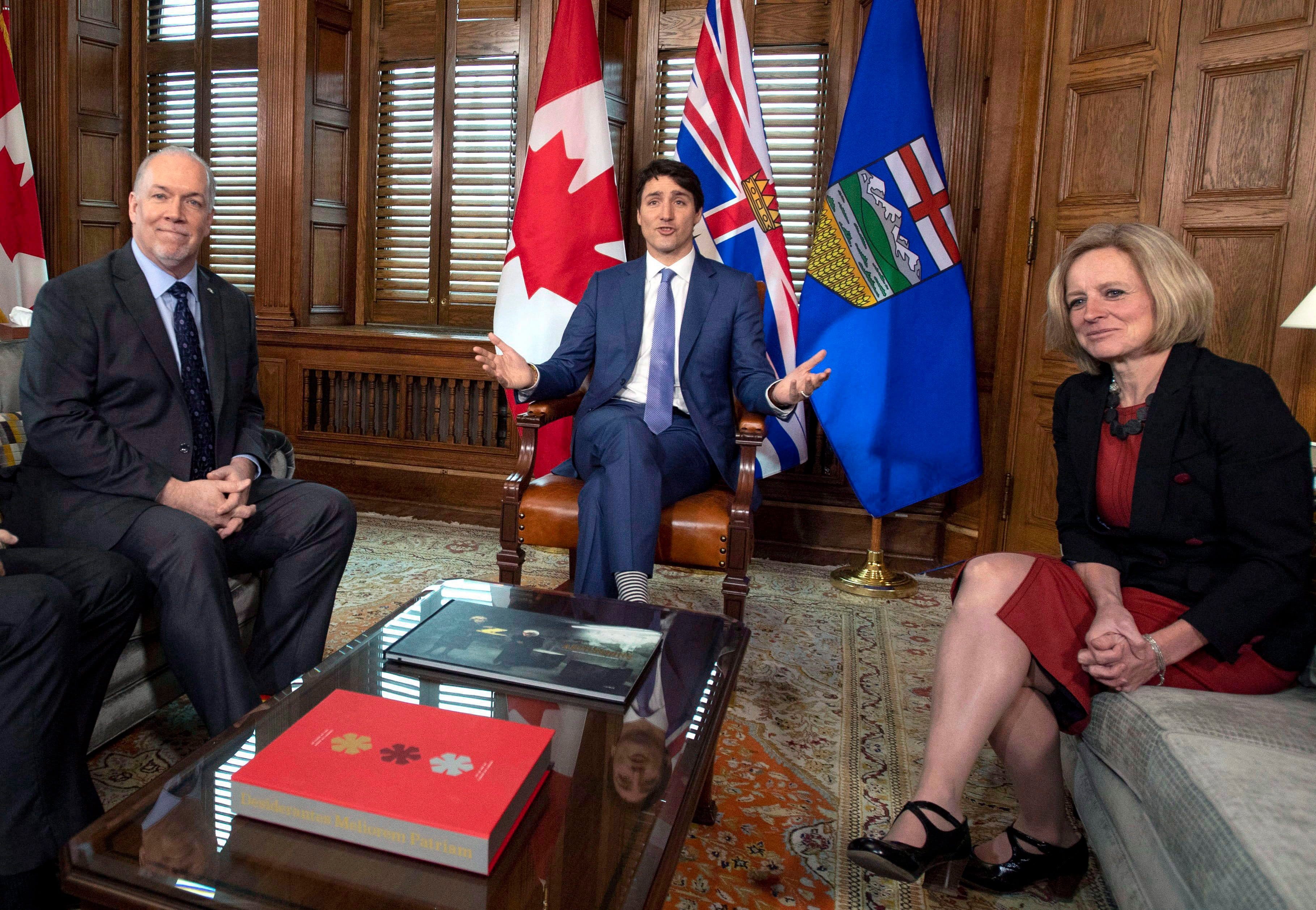 Notley in a hen's-tooth-rare appearance with Trudeau and Horgan, as the three discussed the deadlock over the Trans Mountain pipeline in April 2018. (Justin Tang/CP)