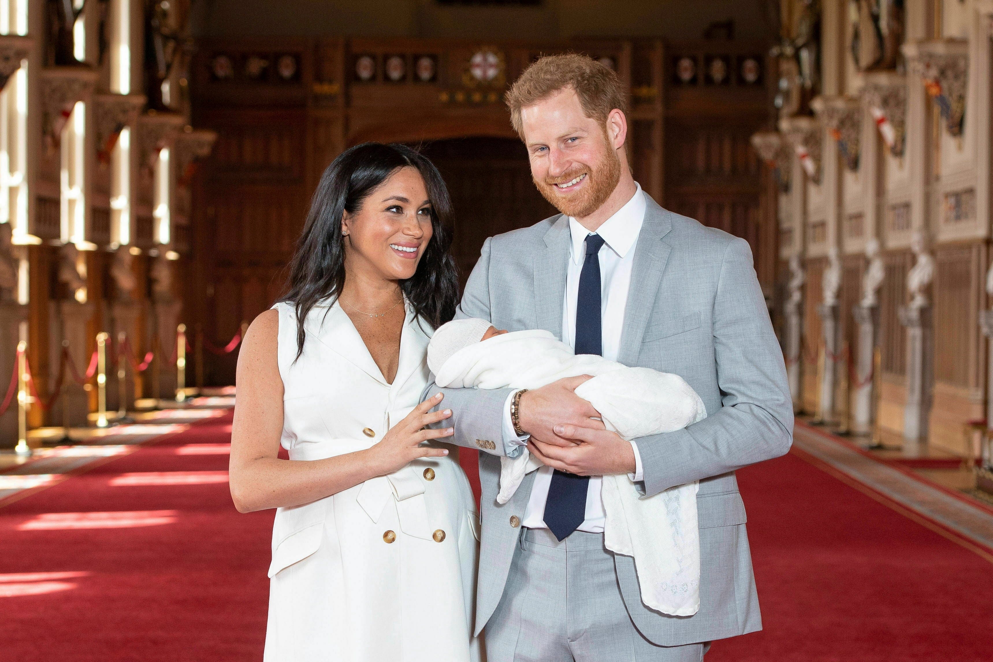 Prince Harry and Meghan, Duchess of Sussex, with their newborn son, in St George's Hall at Windsor Castle, Wednesday May 8, 2019. (Dominic Lipinski/Pool via AP)