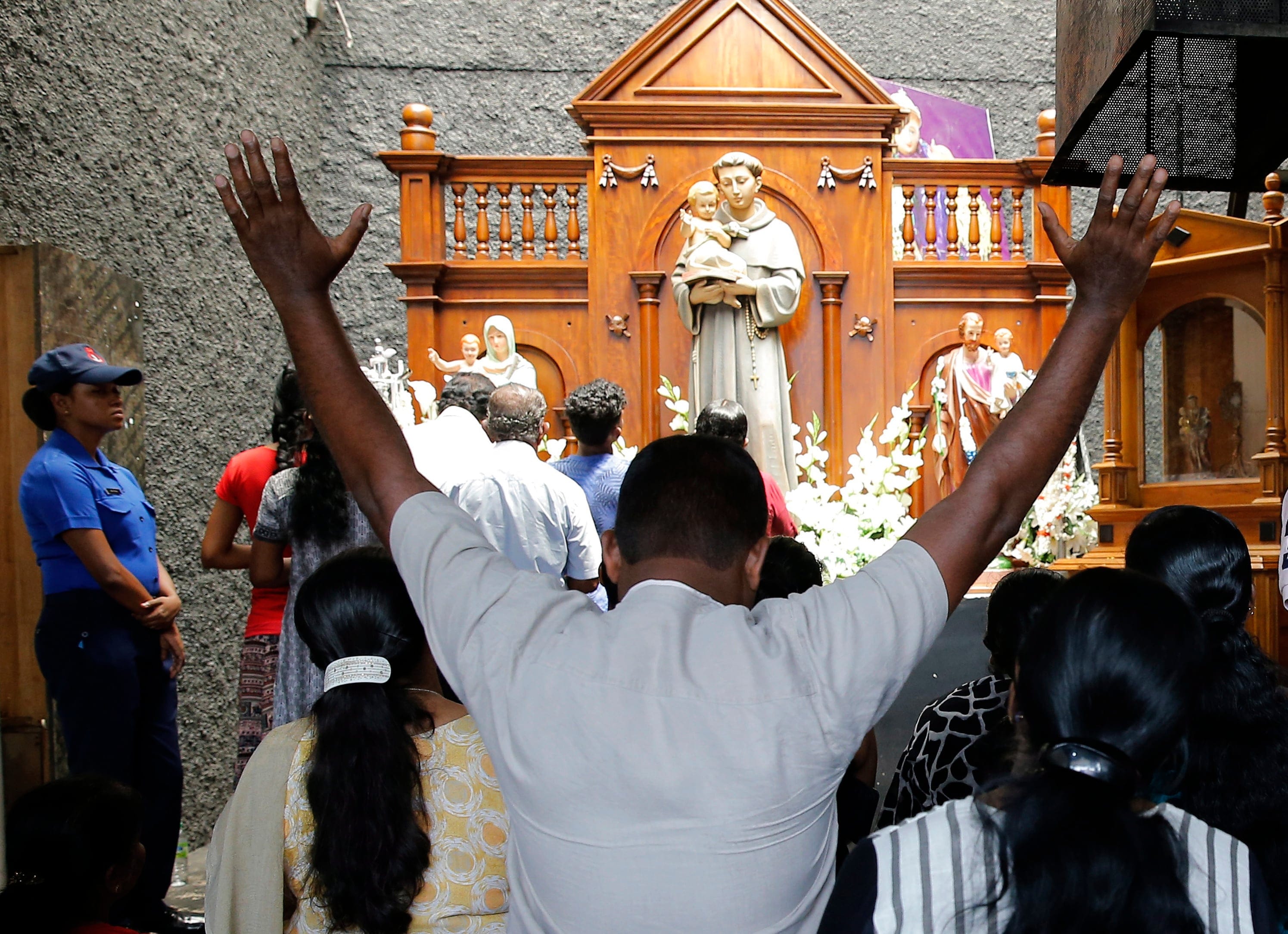 Catholic devotees pray at the St. Anthony's church after it was partially opened for the first time since Easter Sunday attacks, in Colombo, Sri Lanka, Tuesday, May 7, 2019. (AP Photo/Eranga Jayawardena)