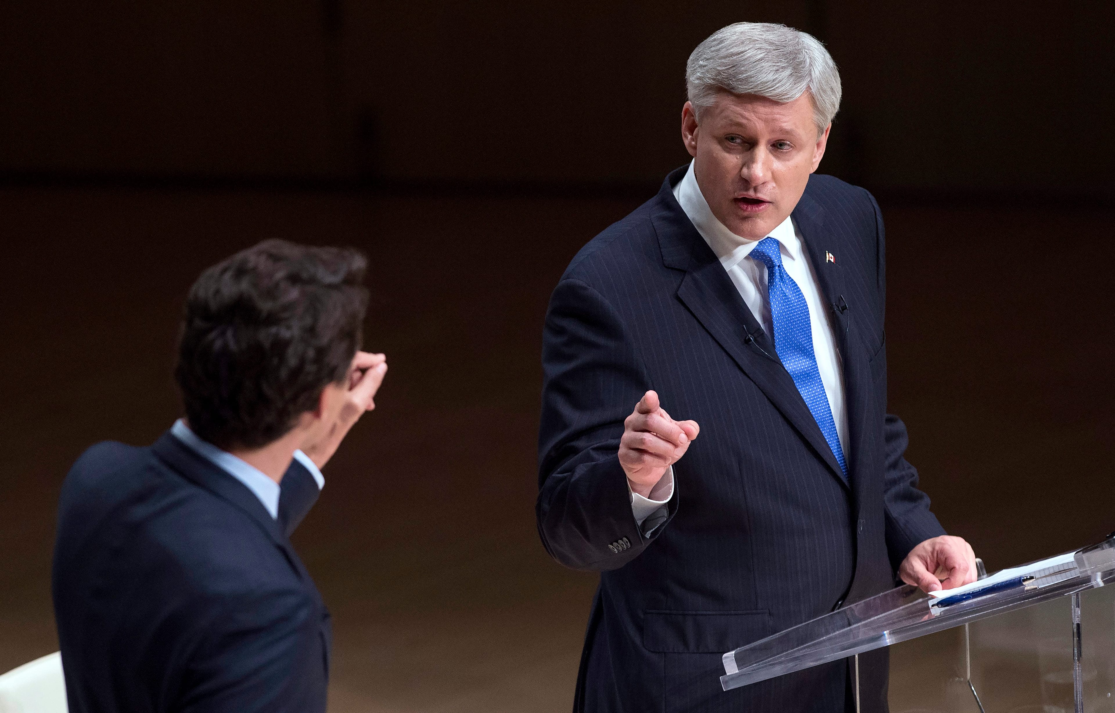 Liberal Leader Justin Trudeau and Conservative Leader Stephen Harper, right, trade words during the Munk Debate on foreign affairs, in Toronto, on Monday, Sept. 28, 2015. THE CANADIAN PRESS/Nathan Denette