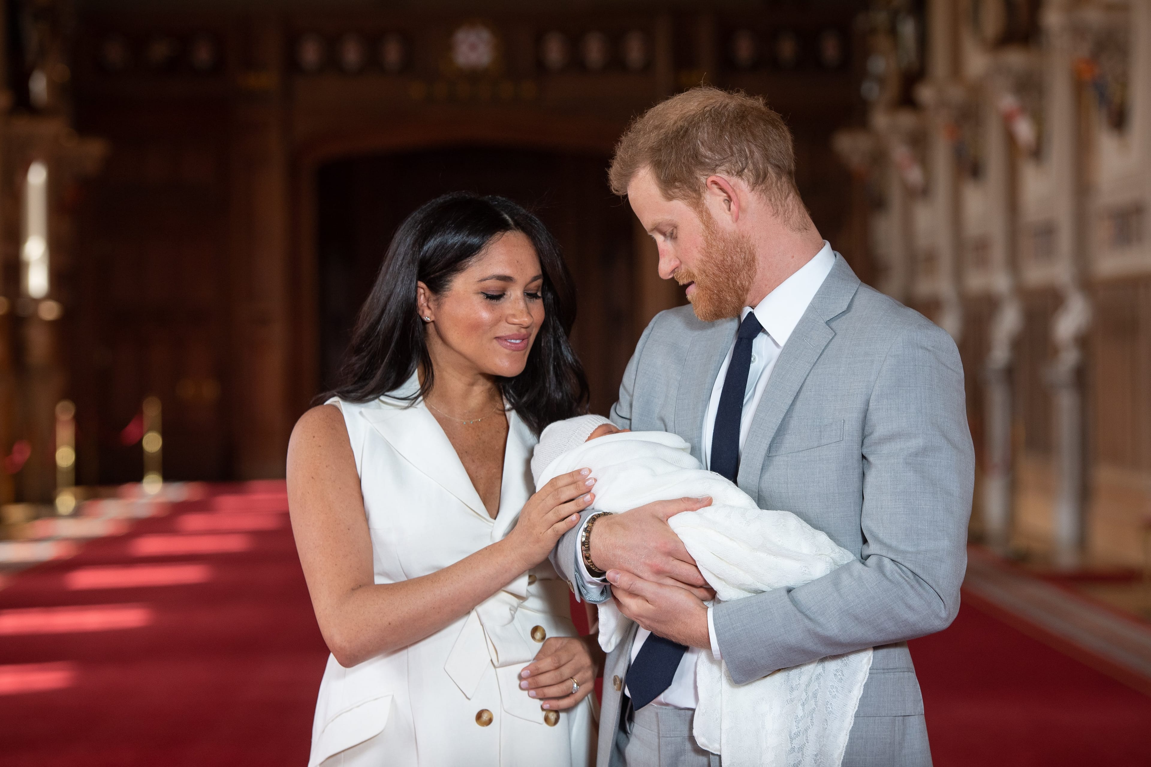 Prince Harry, Duke of Sussex and Meghan, Duchess of Sussex, pose with their newborn son Archie Harrison Mountbatten-Windsor during a photocall in St George's Hall at Windsor Castle on May 8, 2019 in Windsor, England. (Dominic Lipinski/WPA Pool/Getty Images)