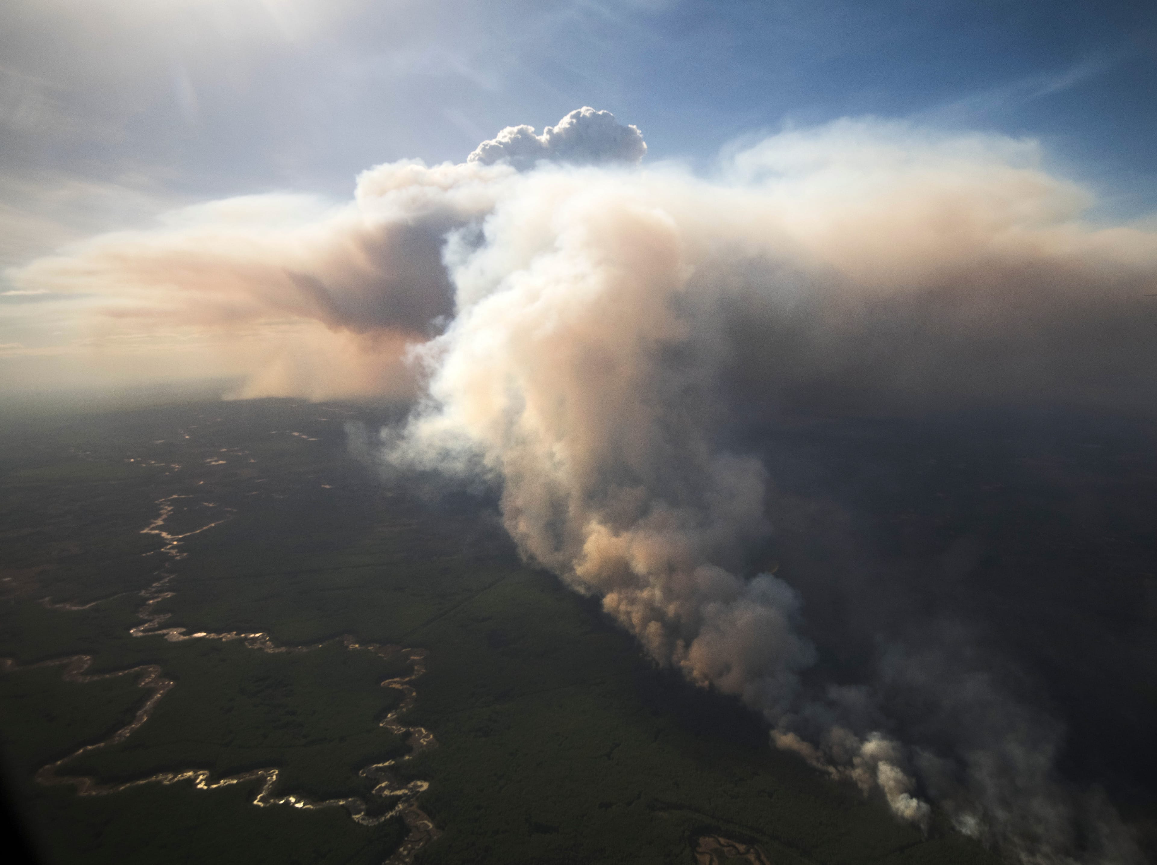 A fire burns near High Level, Alta., in May 2019, forcing thousands from their homes (Chris Schwarz/Government of Alberta/CP)