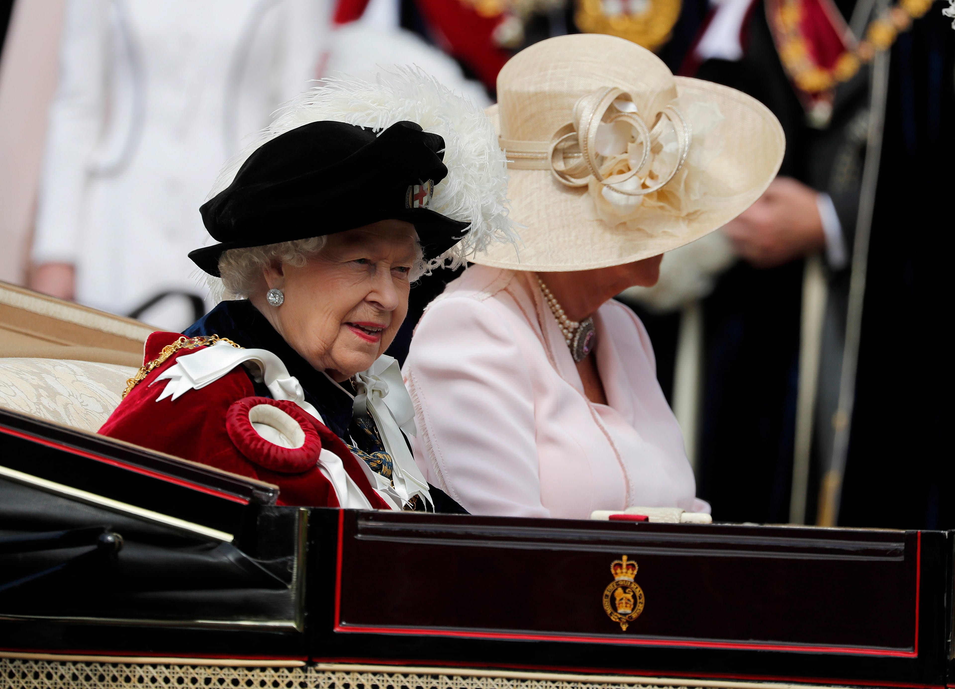 Britain's Queen Elizabeth II and Camilla, the Duchess of Cornwall leave the Order of The Garter Service at Windsor Castle in Windsor, June 17, 2019. (Frank Augstein/AP/CP)