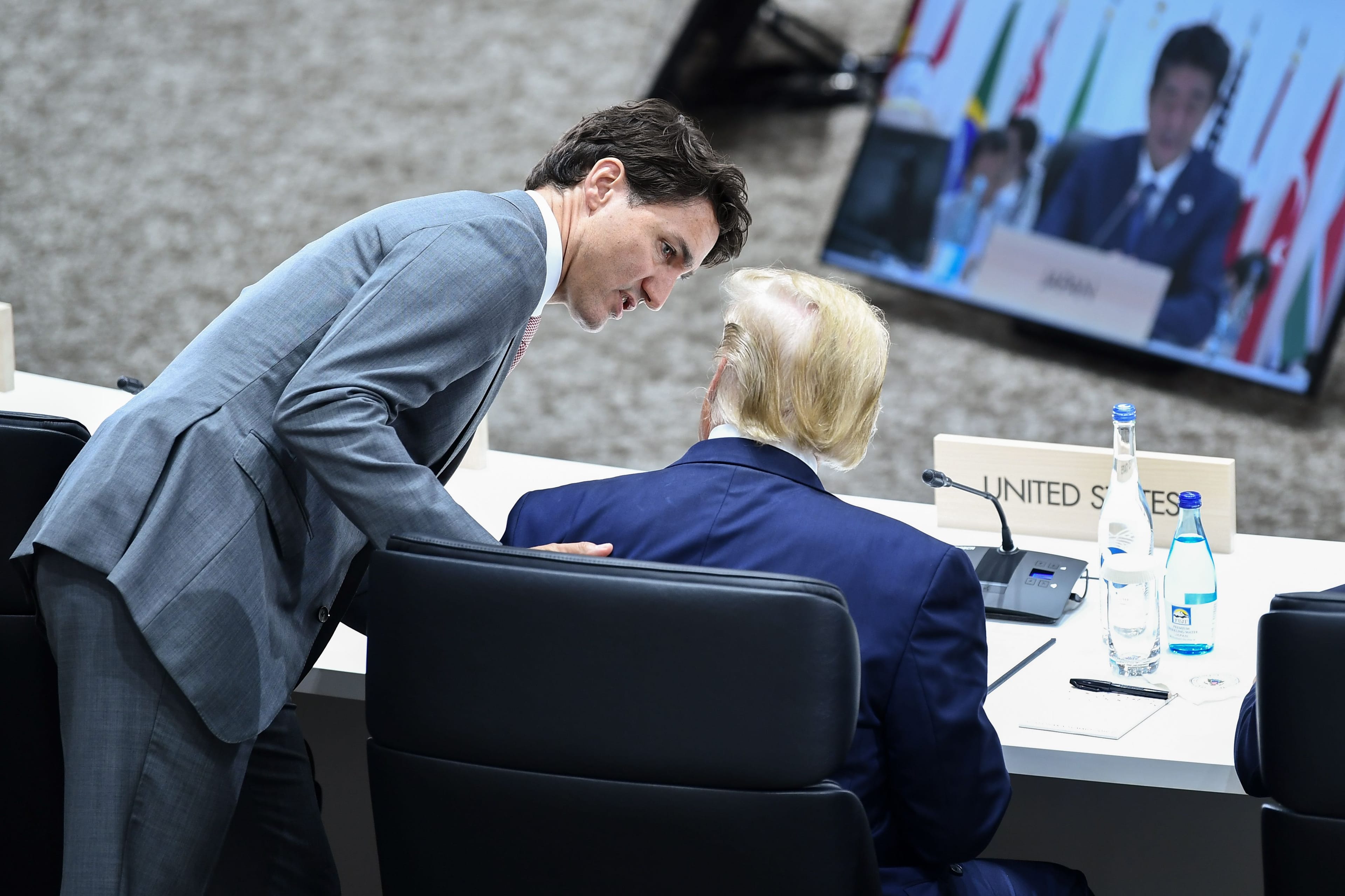 Prime Minister Justin Trudeau speaks with U.S. President Donald Trump during the G20 Summit in Osaka on June 29, 2019. (Brendan Smialowski/AFP/Getty Images)