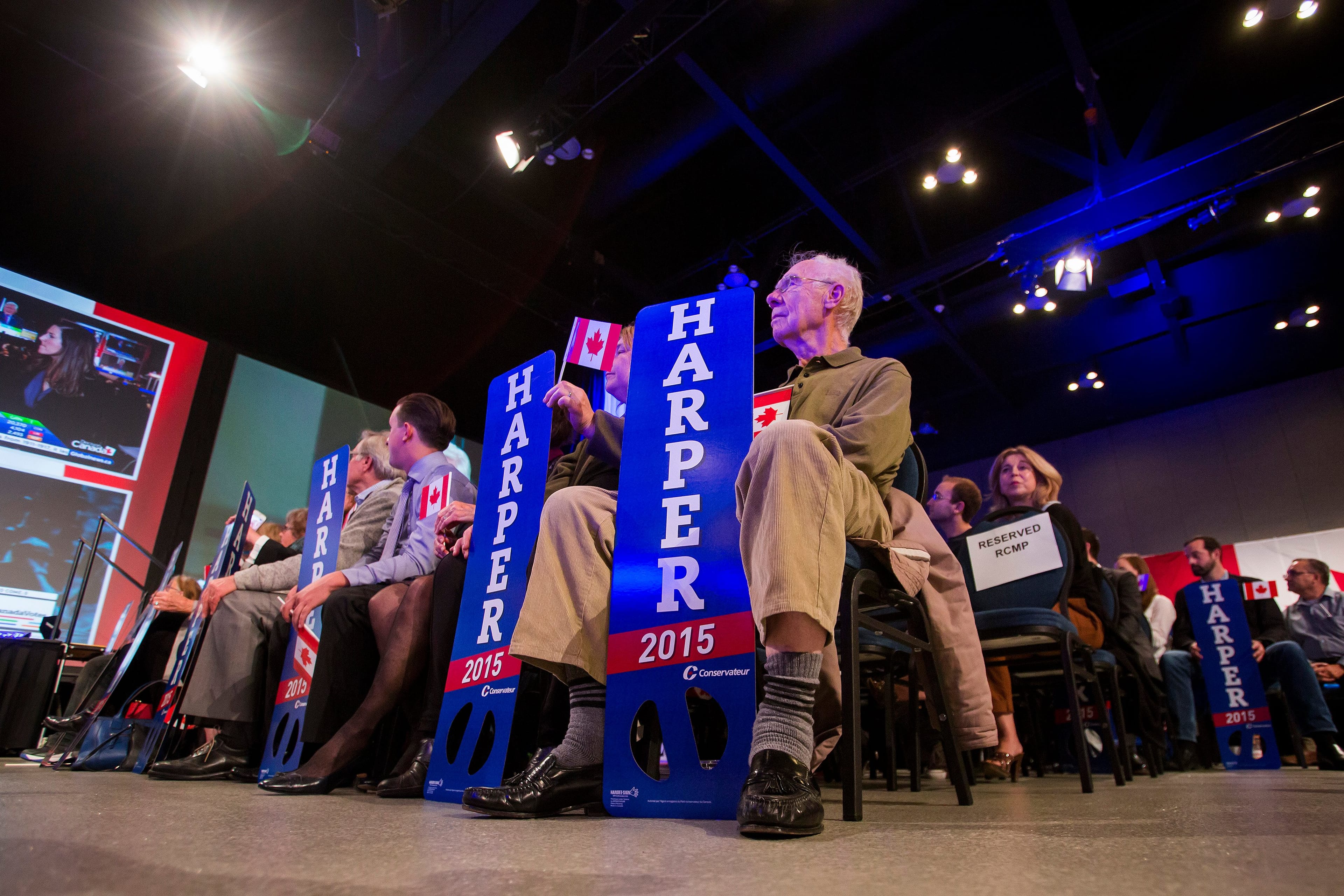 Supporters of Conservative Leader Stephen Harper watch the polls as news agencies project a Liberal government on election day in Calgary, Alberta, Canada, on Monday, Oct. 19, 2015. (Ben Nelms/Bloomerg)