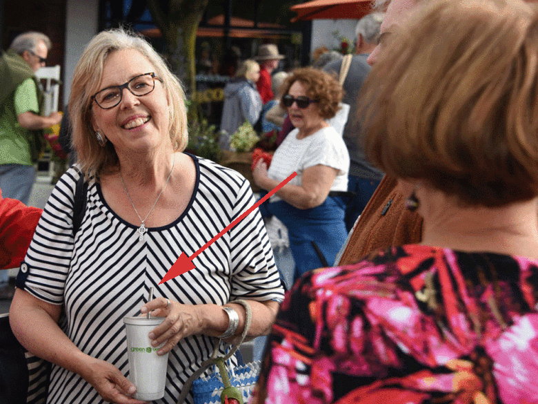 The image of May, with reusable cup and straw, as seen in the National Post (Green Party of Canada)