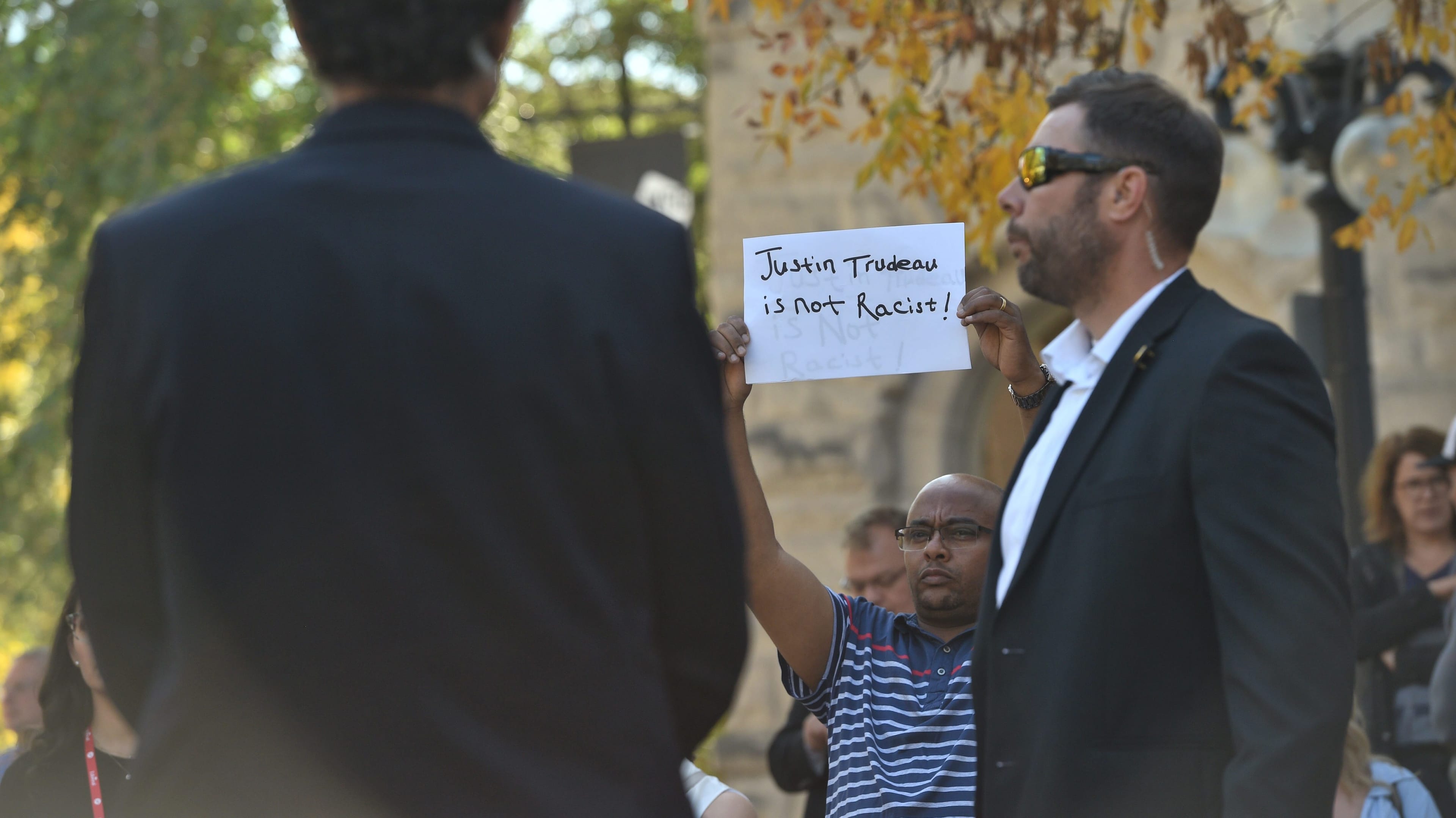 A man shows his support for Liberal Leader Justin Trudeau, as Trudeau addresses media in Winnipeg. (Sean Kilpatrick/CP)