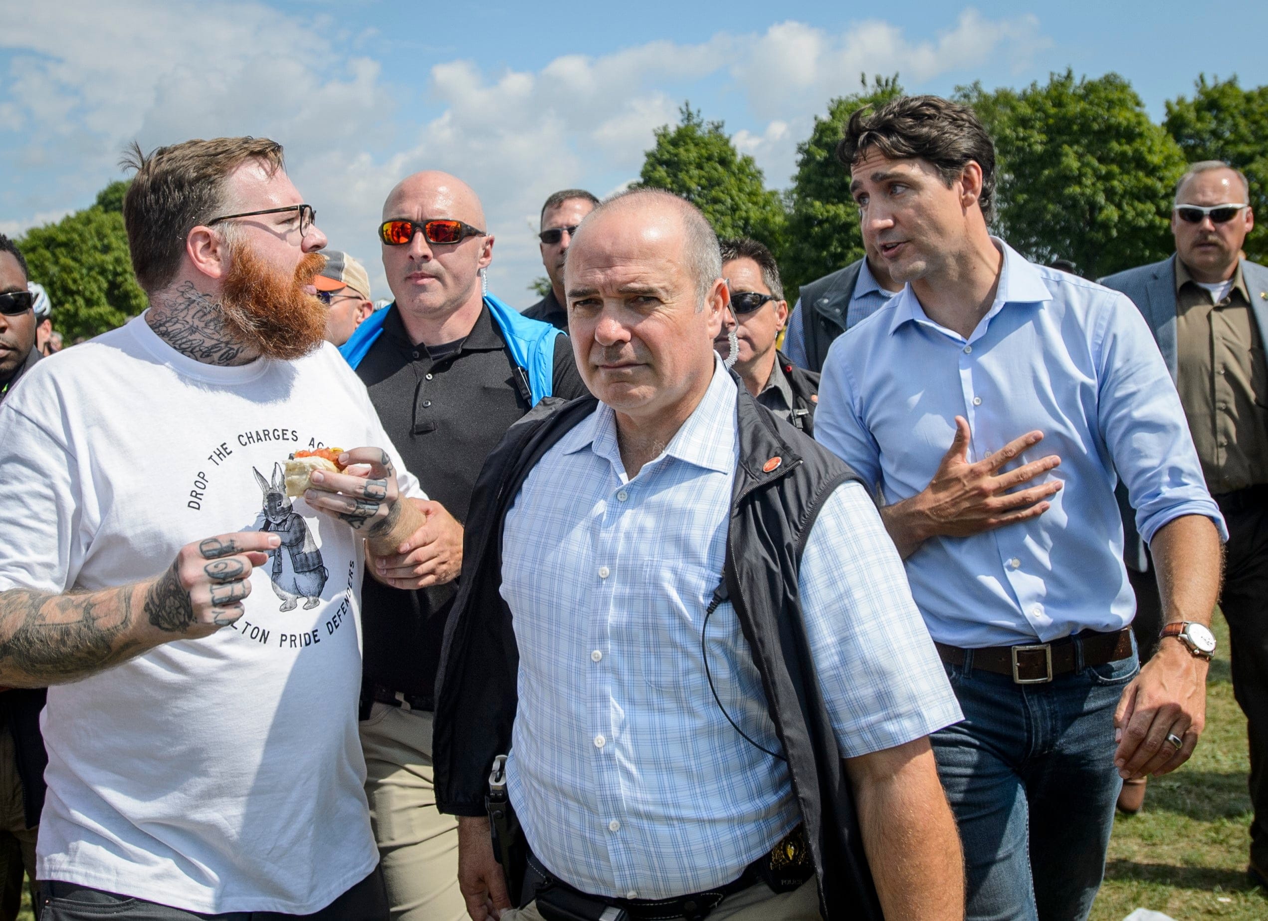A protester yells at Prime Minister Justin Trudeau during a BBQ after the labour day parade in Hamilton, Ont., on Monday, September 2, 2019
