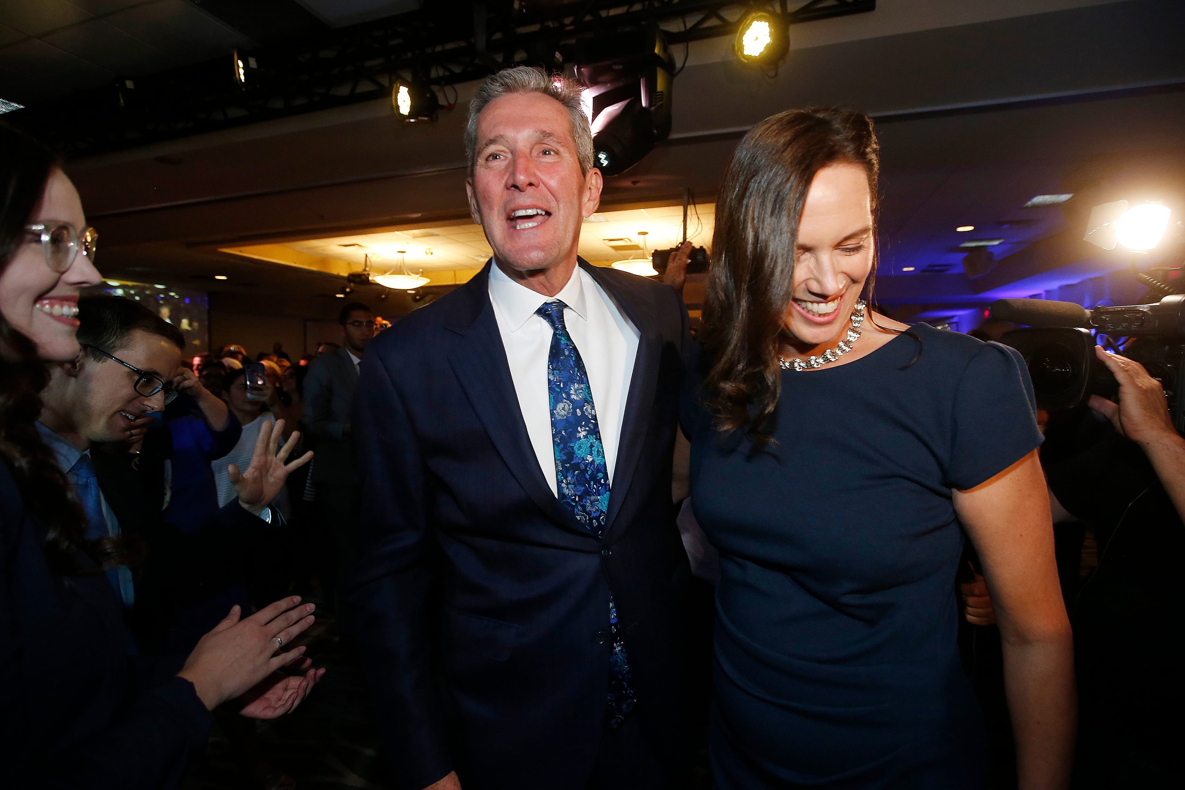 Brian Pallister and wife Esther celebrate the PC's re-election in Manitoba (John Woods/CP)