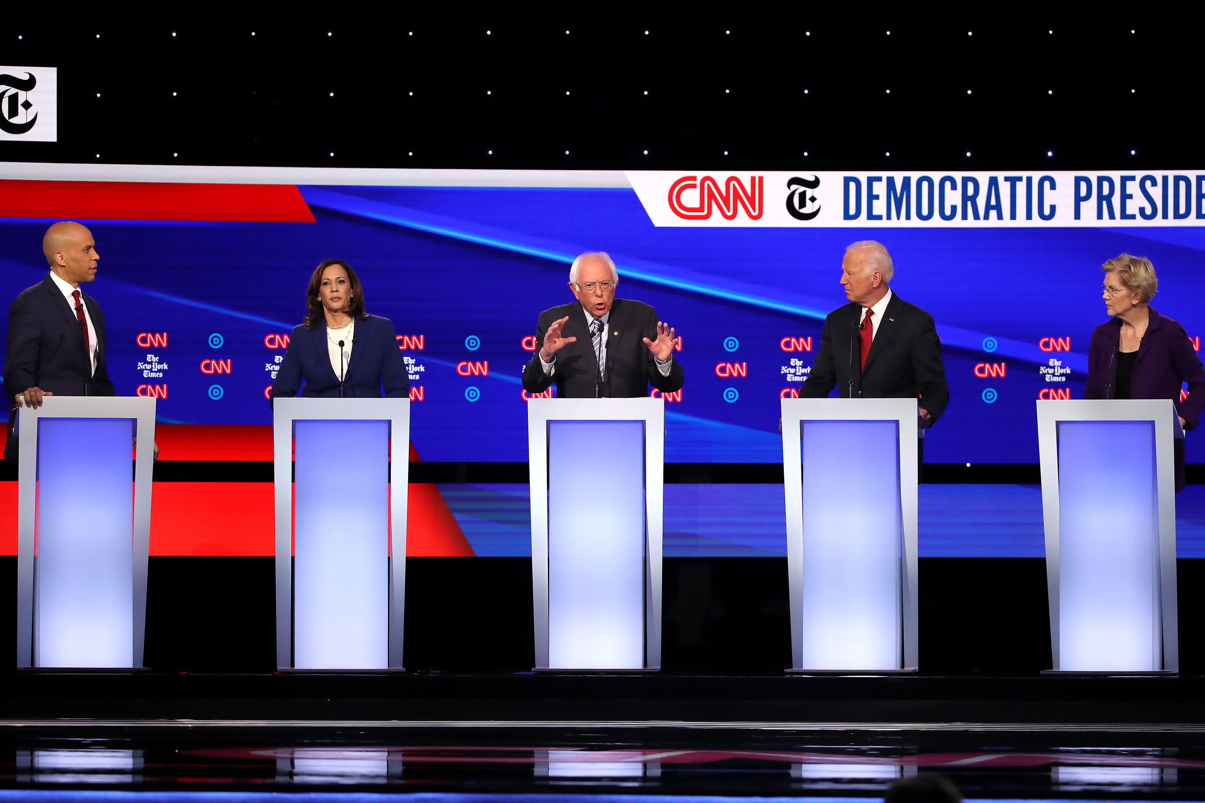 WESTERVILLE, OHIO - OCTOBER 15: Sen. Cory Booker (D-NJ), Sen. Kamala Harris (D-CA), Sen. Bernie Sanders (I-VT), former Vice President Joe Biden, and Sen. Elizabeth Warren (D-MA)  interact during the Democratic Presidential Debate at Otterbein University on October 15, 2019 in Westerville, Ohio. A record 12 presidential hopefuls are participating in the debate hosted by CNN and The New York Times. (Photo by Win McNamee/Getty Images)