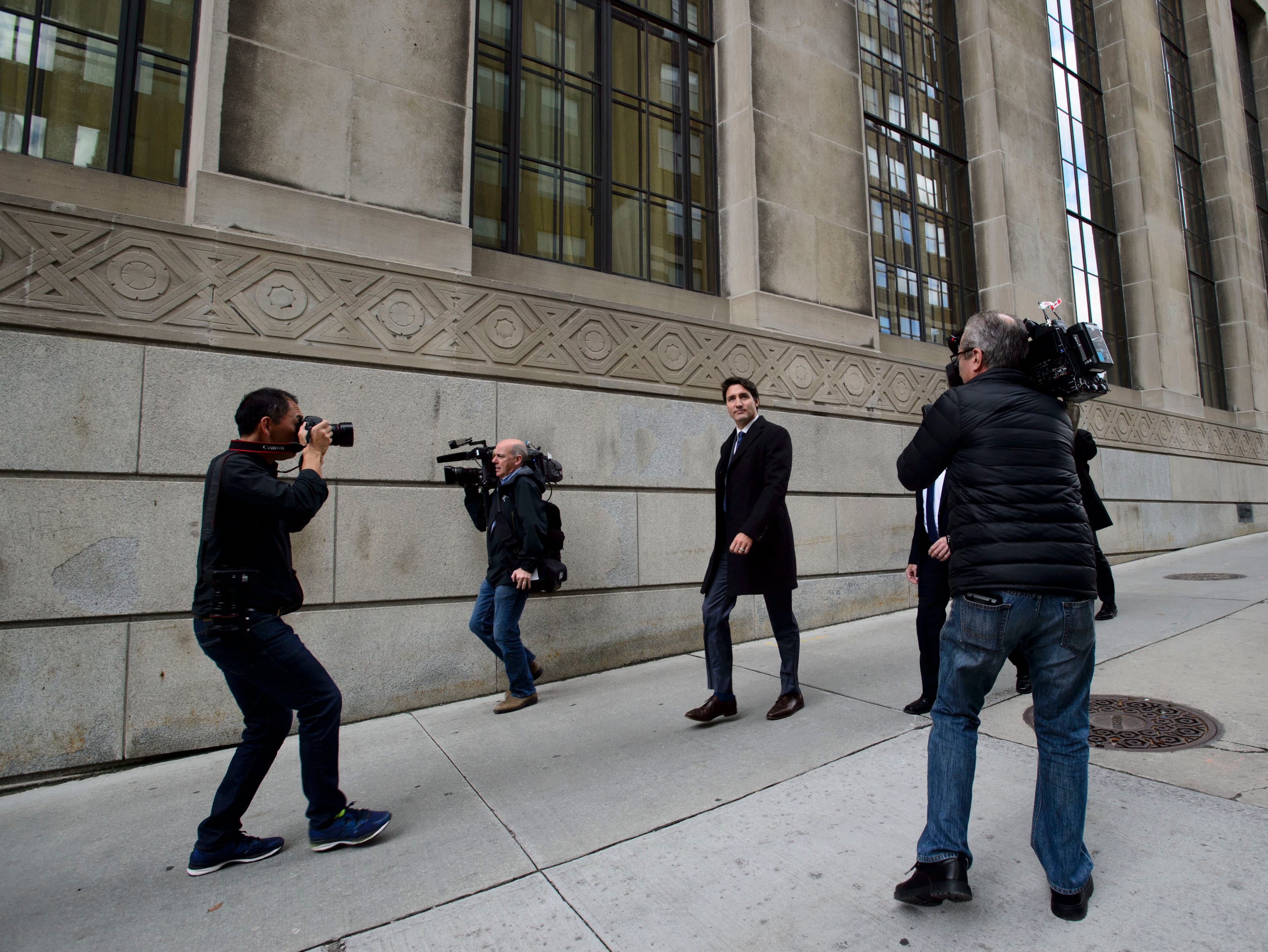 Trudeau makes his way from a press conference at the National Press Theatre in Ottawa on Oct. 23, 2019 (THE CANADIAN PRESS/Sean Kilpatrick)