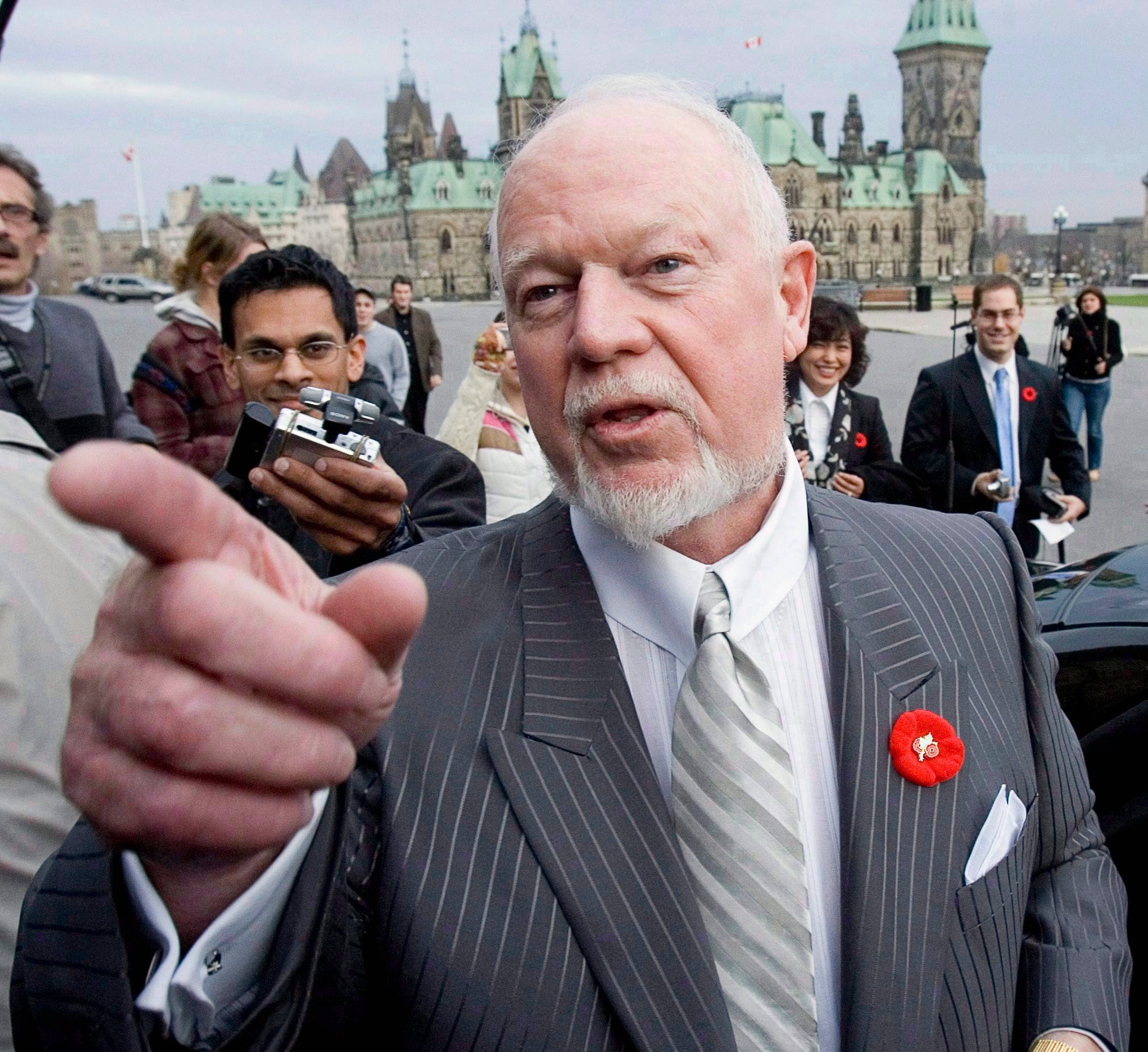 Cherry talks with reporters outside the Parliament buildings in Ottawa in 2006. Cherry was fired from his job on Coach's Corner earlier this month. (Tom Hanson/CP)