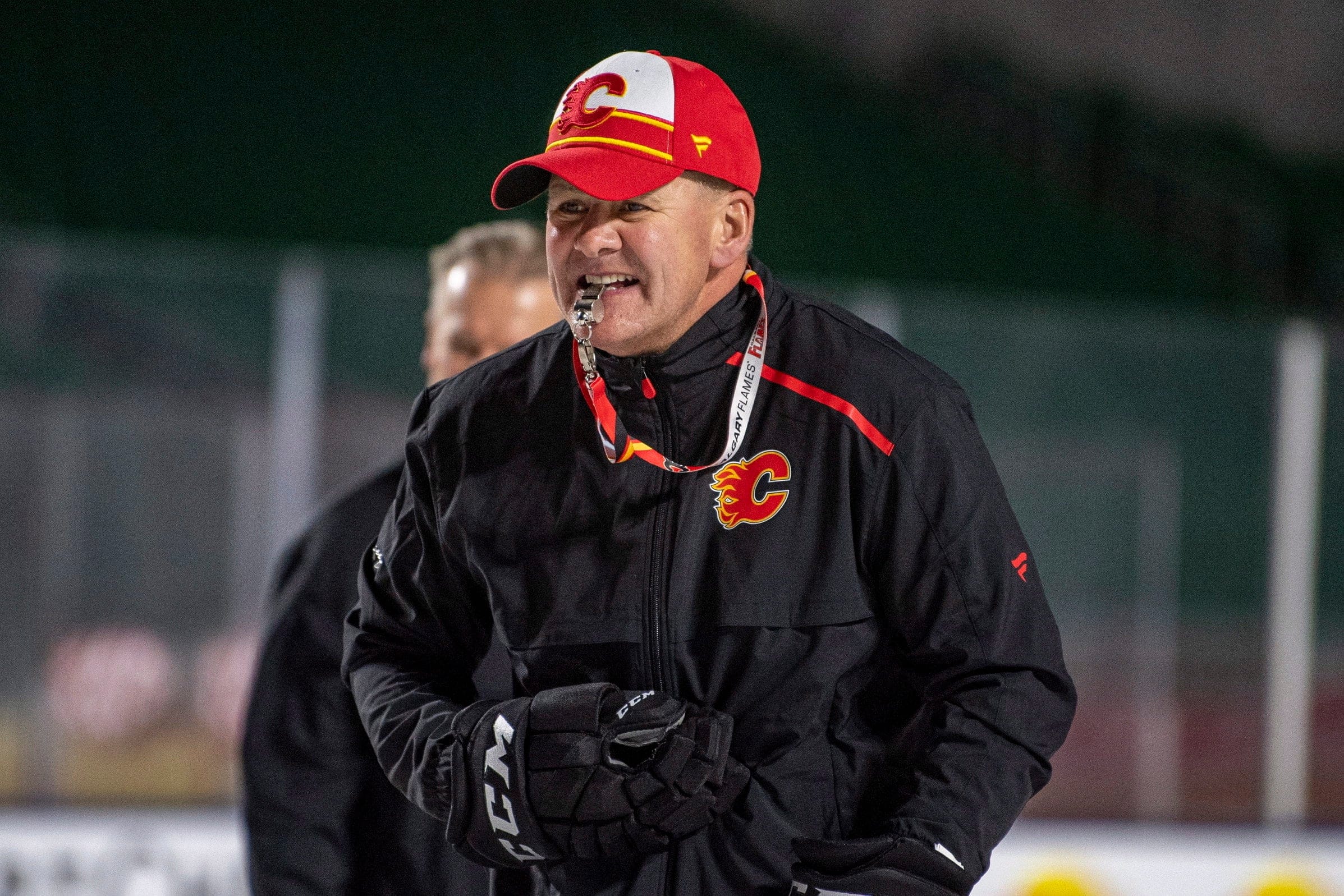 In this Oct. 25, 2019, file photo, Calgary Flames coach Bill Peters watches practice in Regina, Saskatchewan, ahead of the NHL Heritage Classic outdoor hockey game against the Winnipeg Jets.(Liam Richards/CP)