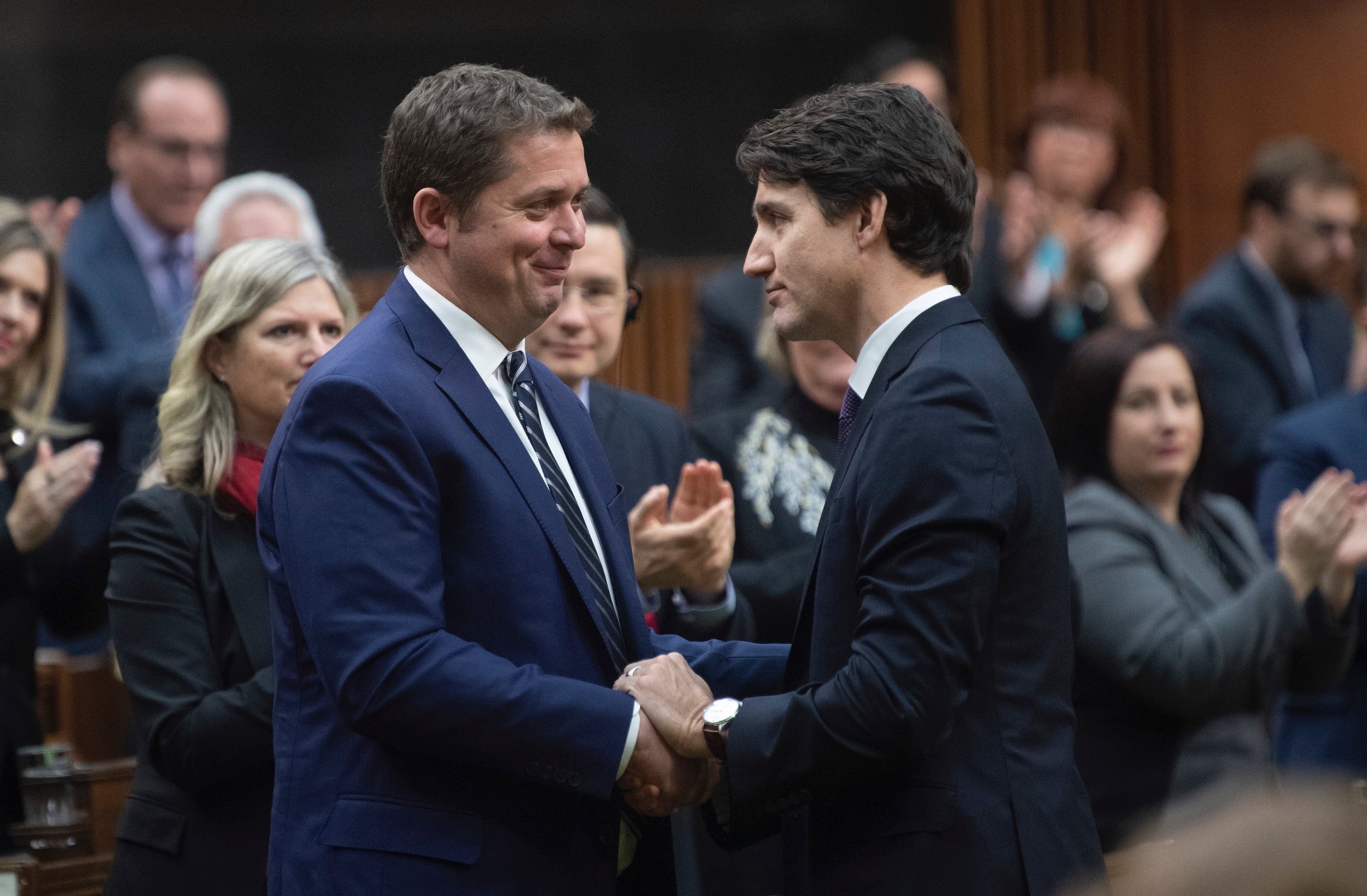 Prime Minister Justin Trudeau shakes hands with Leader of the Opposition Andrew Scheer after he announced he will step down as leader of the Conservatives, Thursday December 12, 2019 in the House of Commons in Ottawa. (Adrian Wyld/CP)