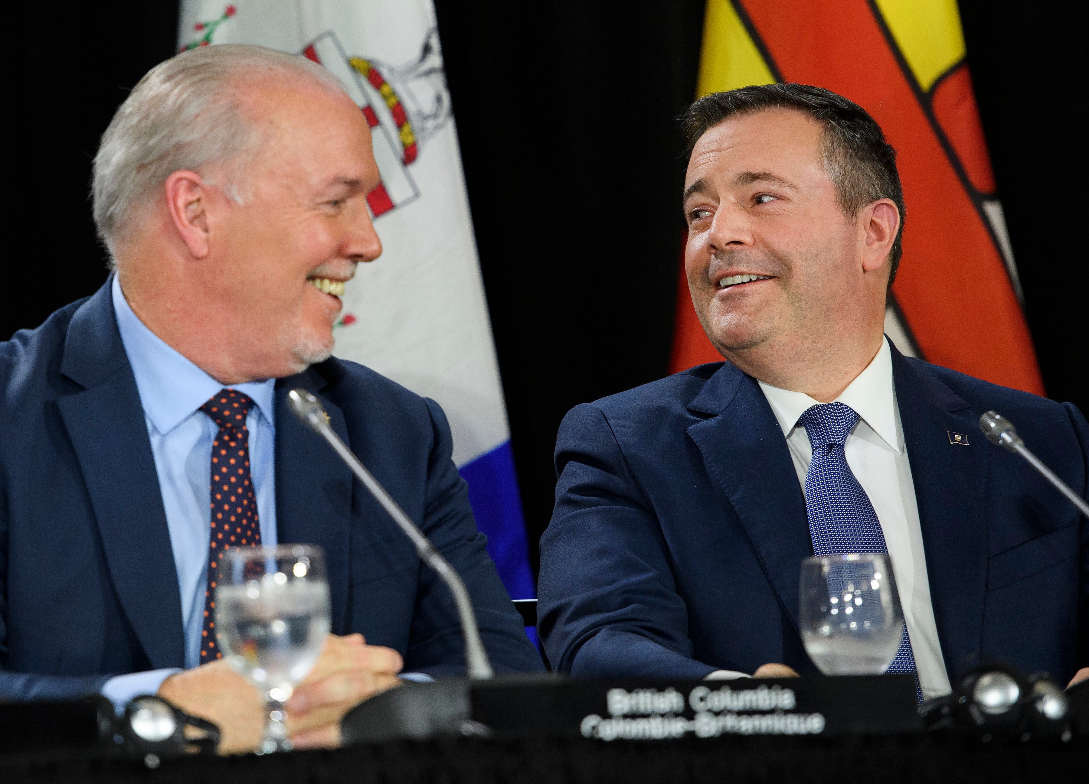 John Horgan, left, Premier of British Columbia and Jason Kenney, Premier of Alberta look at each other during press conference after a meeting of the Council of the Federation, which comprises all 13 provincial and territorial leaders, in Mississauga, Ont., on Monday, Dec. 2, 2019. (Nathan Denette/CP)
