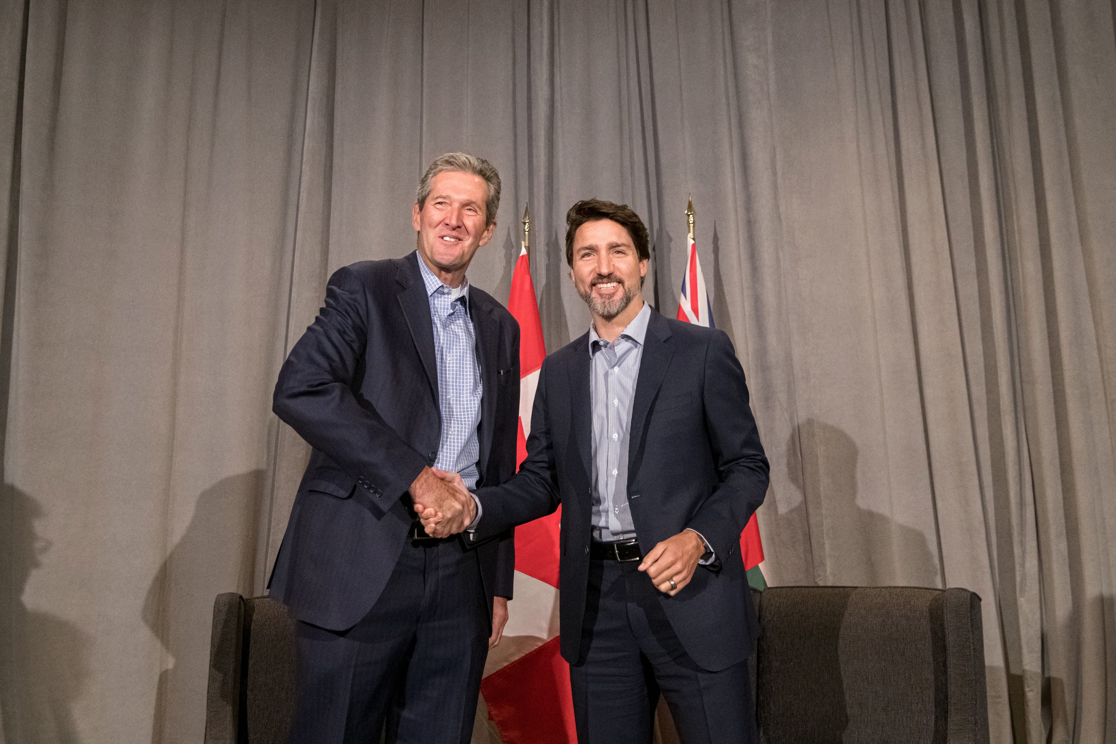 Manitoba Premier Brian Pallister shakes hands with Prime Minister Justin Trudeau before speaking to media during day 2 of the Liberal cabinet retreat at the Fairmont Hotel in Winnipeg on Jan. 20, 2020. (Mike Sudoma/CP)