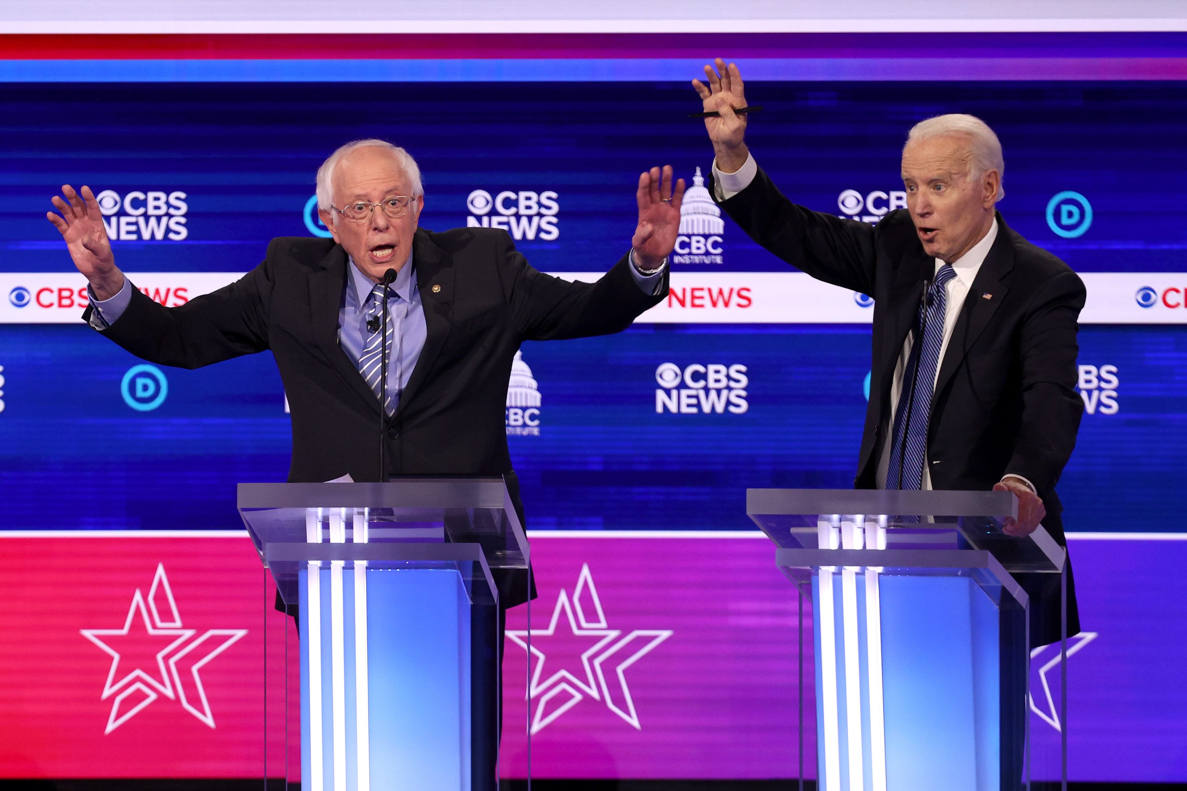 Democratic presidential candidate Sen. Bernie Sanders (left) speaks as former vice-president Joe Biden reacts during the Democratic presidential primary debate at the Charleston Gaillard Center on Feb. 25, 2020 in Charleston, South Carolina.  (Win McNamee/Getty Images)