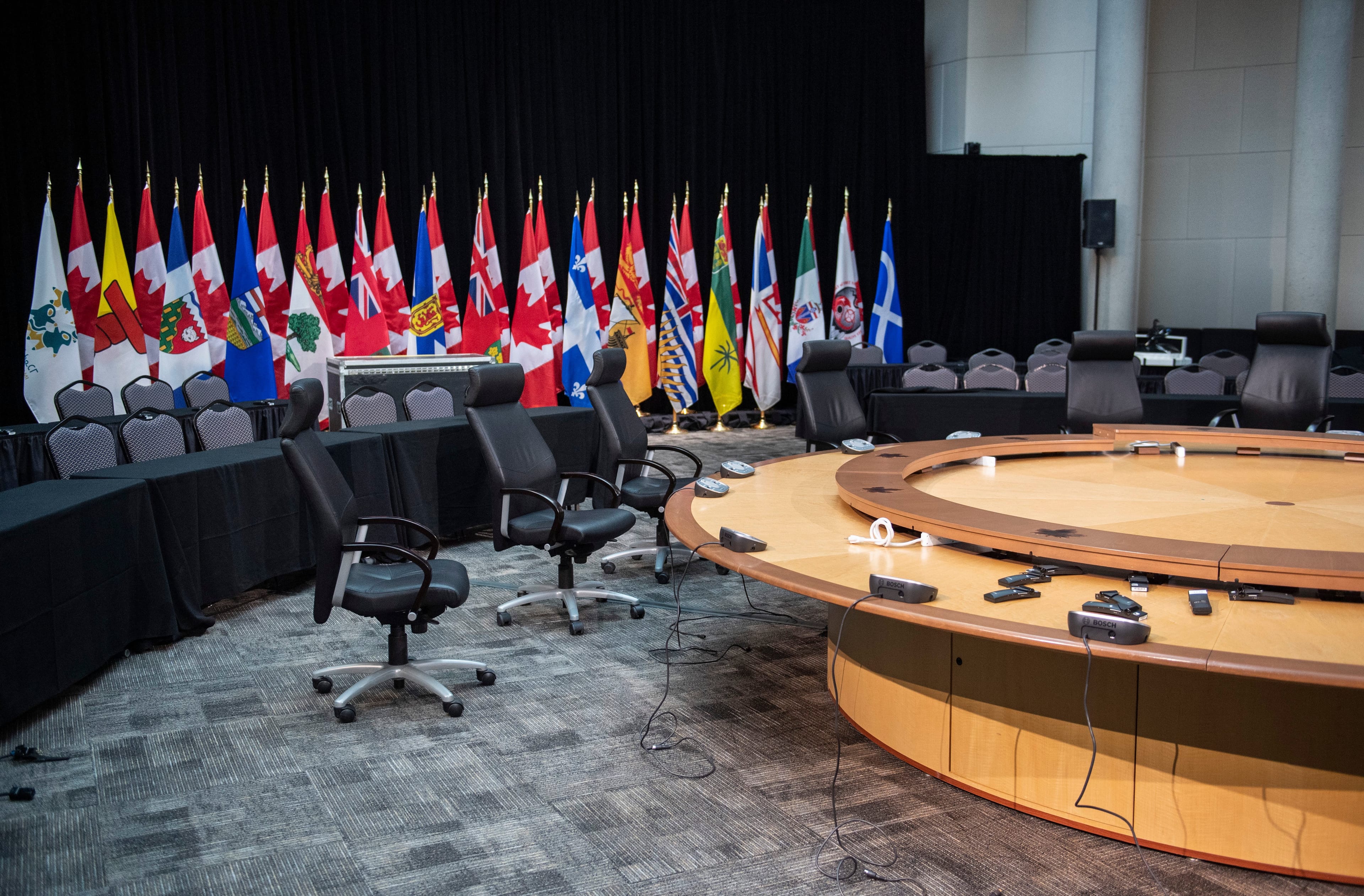 Swivel chairs surround a table in the large meeting room at the John G. Diefenbaker Building, where Prime Minister Justin Trudeau was set to attend the First Ministers' Meeting and hold meetings with national Indigenous leaders before it was cancelled due to the COVID-19 outbreak, in Ottawa, on Thursday, March 12, 2020. (Justin Tang/CP)