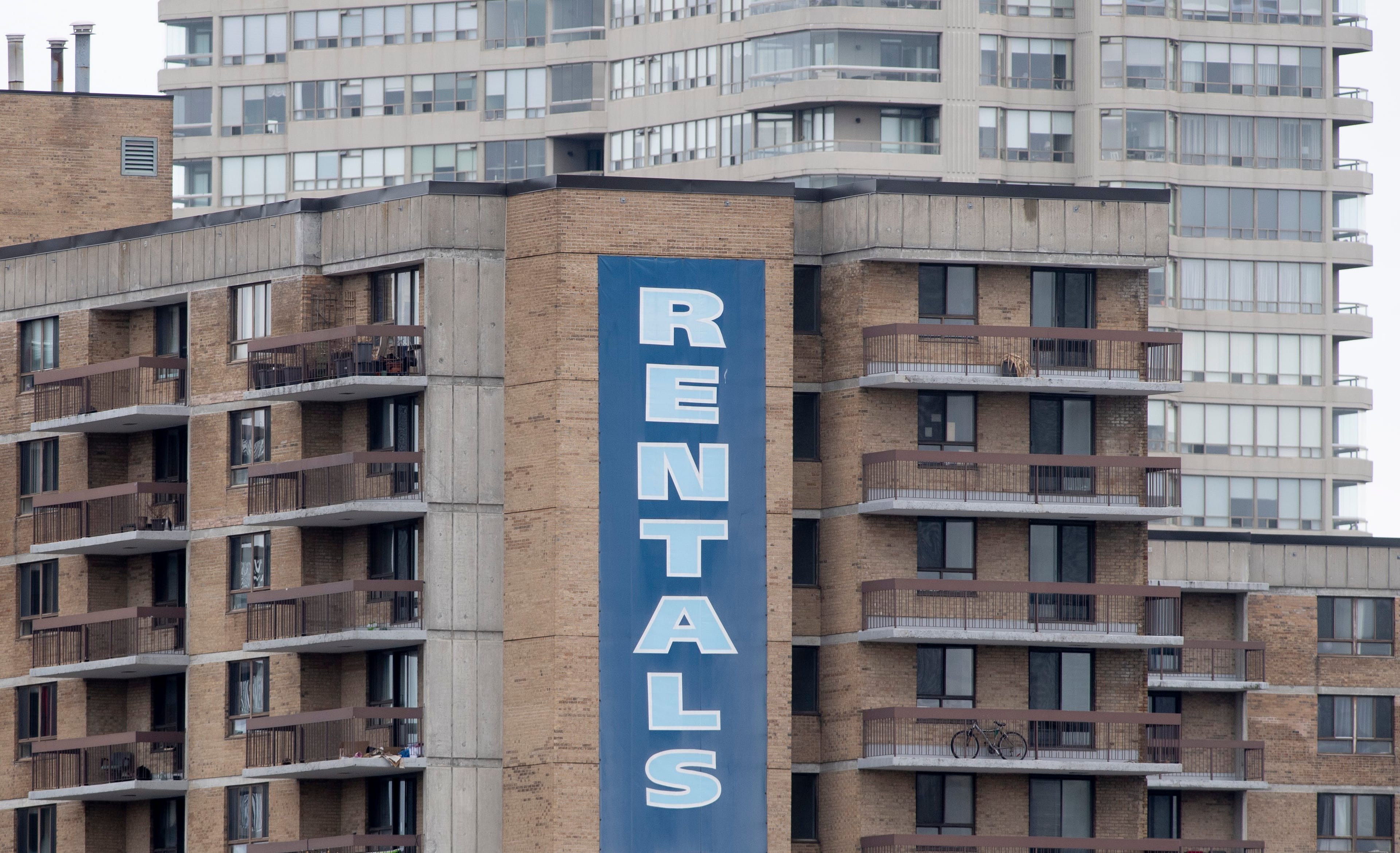 A rental sign hangs on the side of an apartment building in Ottawa on Tuesday March 31, 2020. (Adrian Wyld/CP)