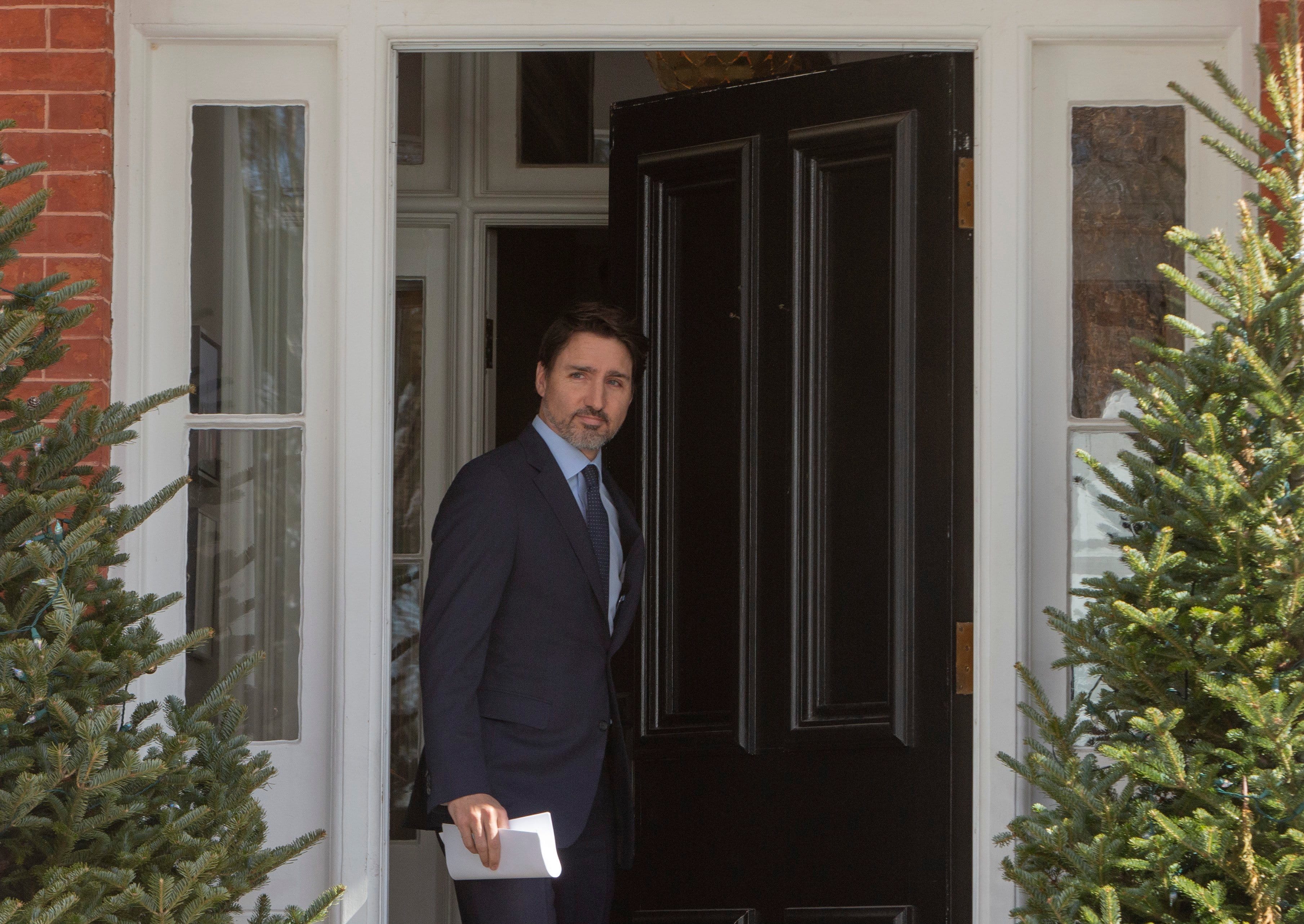 Justin Trudeau emerges from Rideau Cottage on Friday to hold a news conference. (Fred Chartrand/CP)
