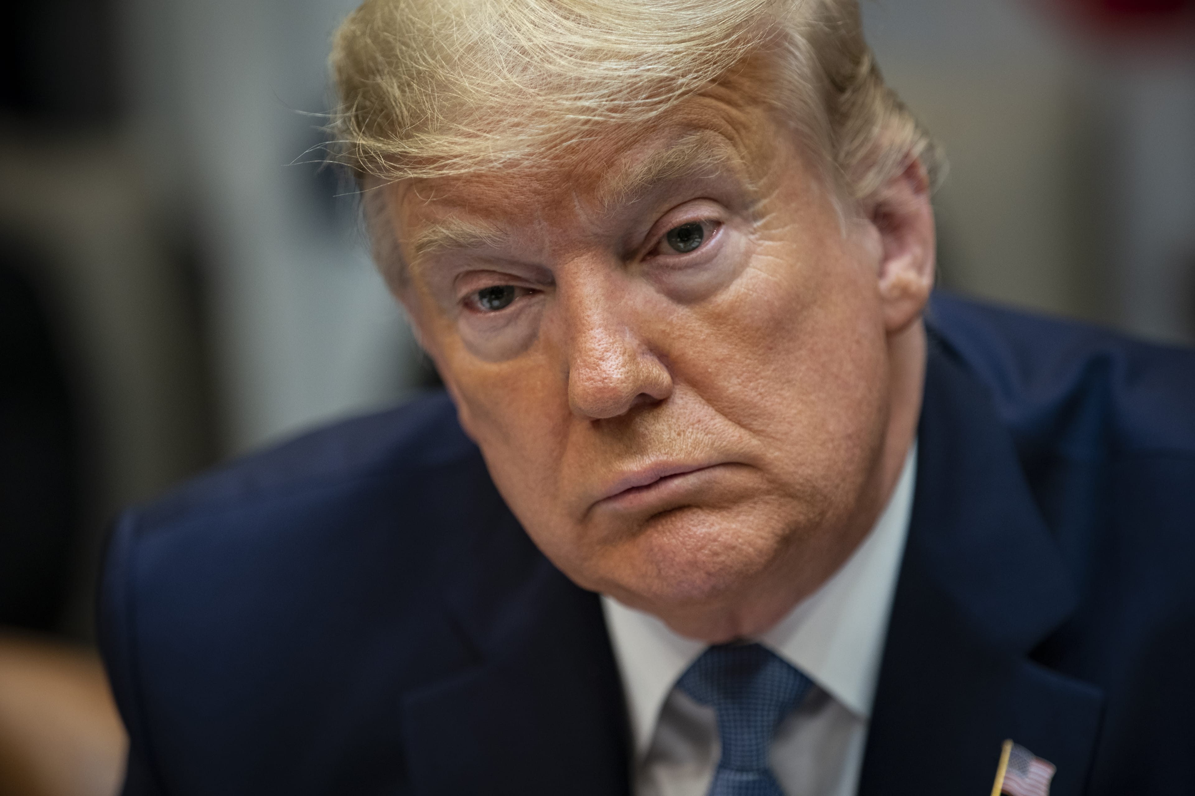 Trump listens on Tuesday during a coronavirus briefing with health insurers in the Roosevelt Room of the White House (Al Drago/Bloomberg via Getty Images)
