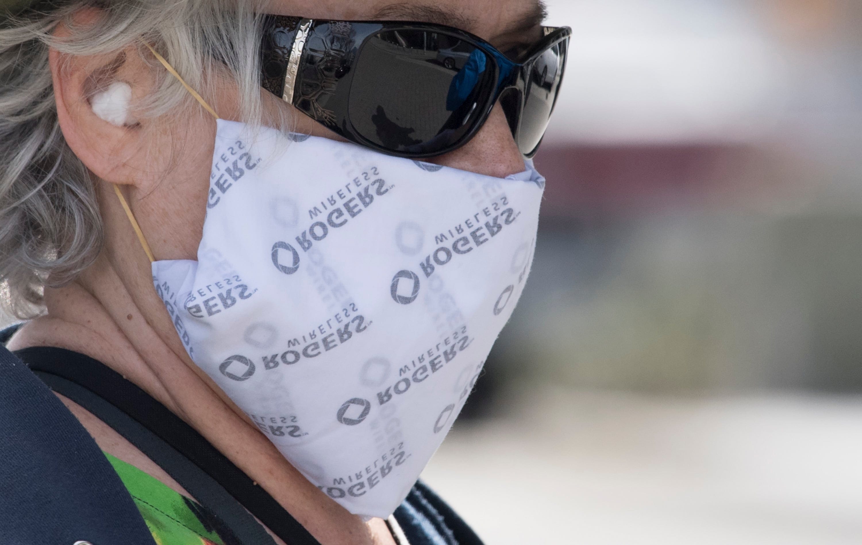 A woman wears a homemade mask as she goes for a walk in Vancouver (Jonathan Hayward/CP)