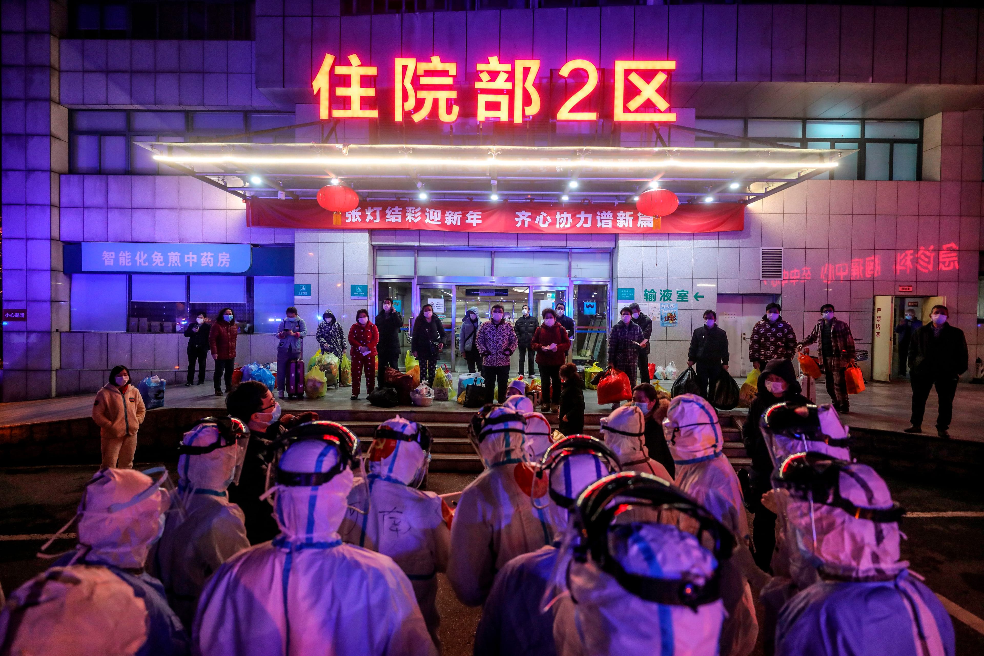 Patients infected with COVID-19 wait to be transferred from Wuhan No. 5 Hospital to the newly-built Leishenshan Hospital in Wuhan, China on March 3, 2020 (AFP/Getty Images)