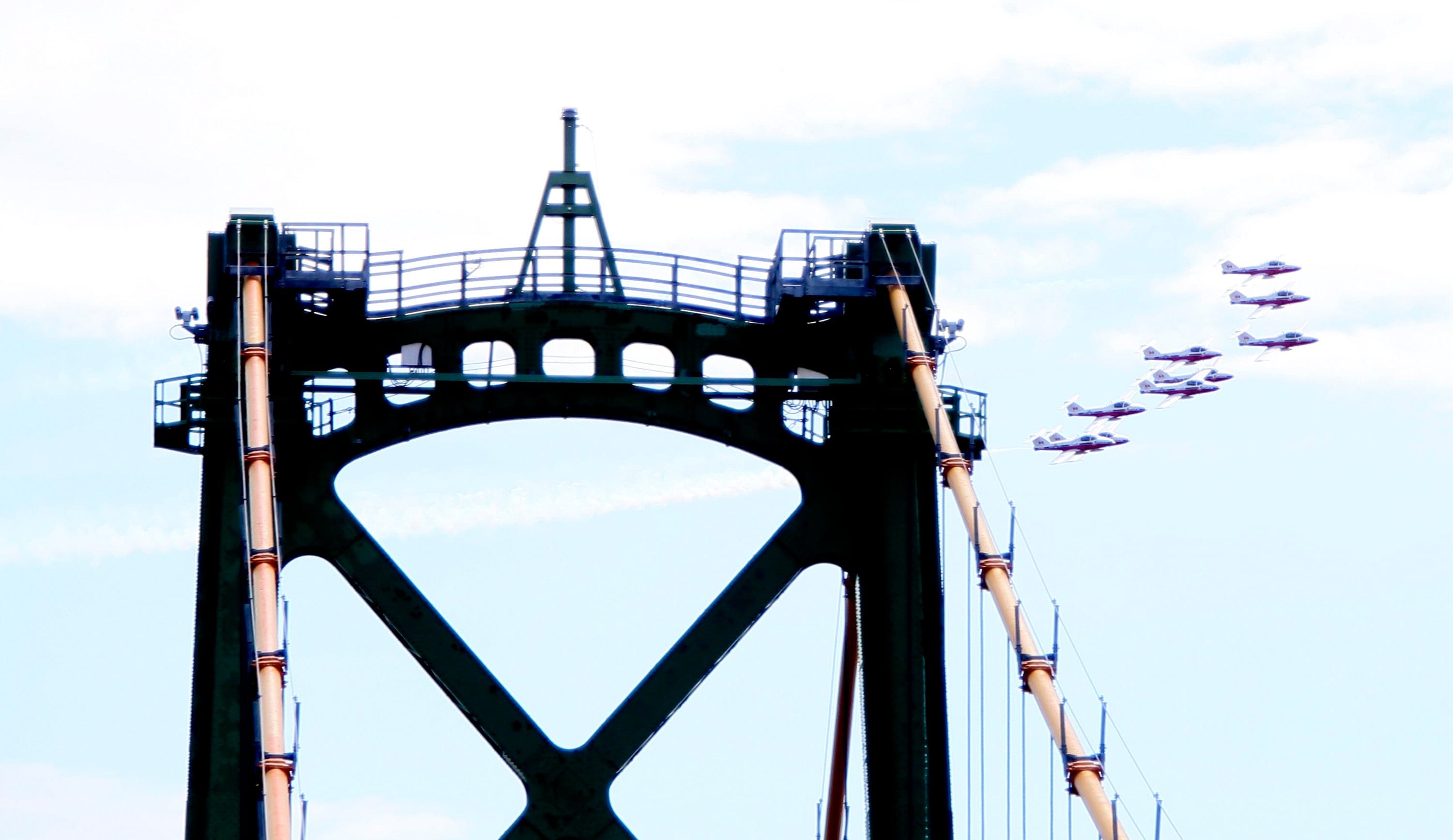 The Canadian Armed Forces aerobatic team, the Snowbirds, backdrops one of the twin towers on the Angus L. Macdonald Bridge during the team’s flyover in Halifax, Sunday, May 3, 2020. The team flew over Nova Scotia communities Sunday in remembrance of the victims of a mass shooting and six deaths in last week's navy helicopter crash.THE CANADIAN PRESS/Tim Krochak