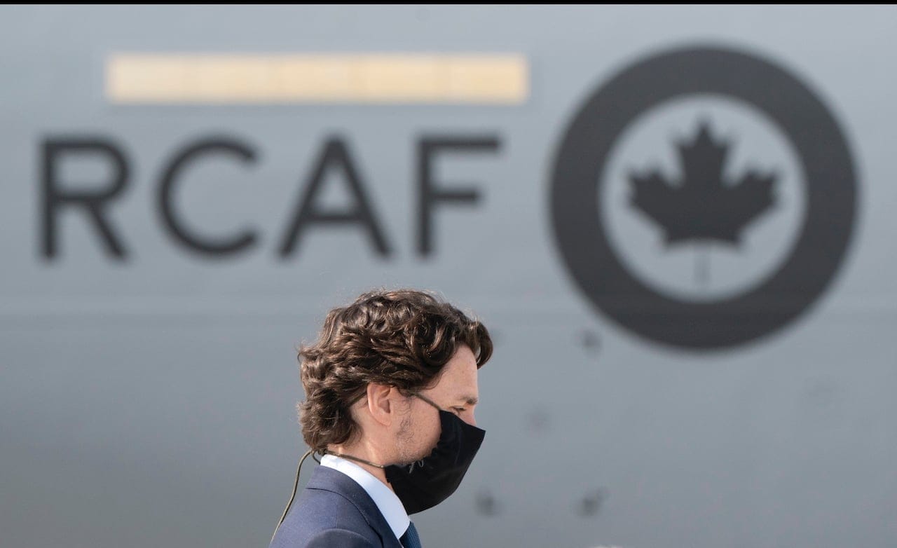 Prime Minister Justin Trudeau attends a repatriation ceremony for the six Canadian Armed Forces members killed in a helicopter crash off of Greece during Operation Reassurance, at CFB Trenton, Ont. on Wednesday, May 6, 2020. (Frank Gunn/CP)