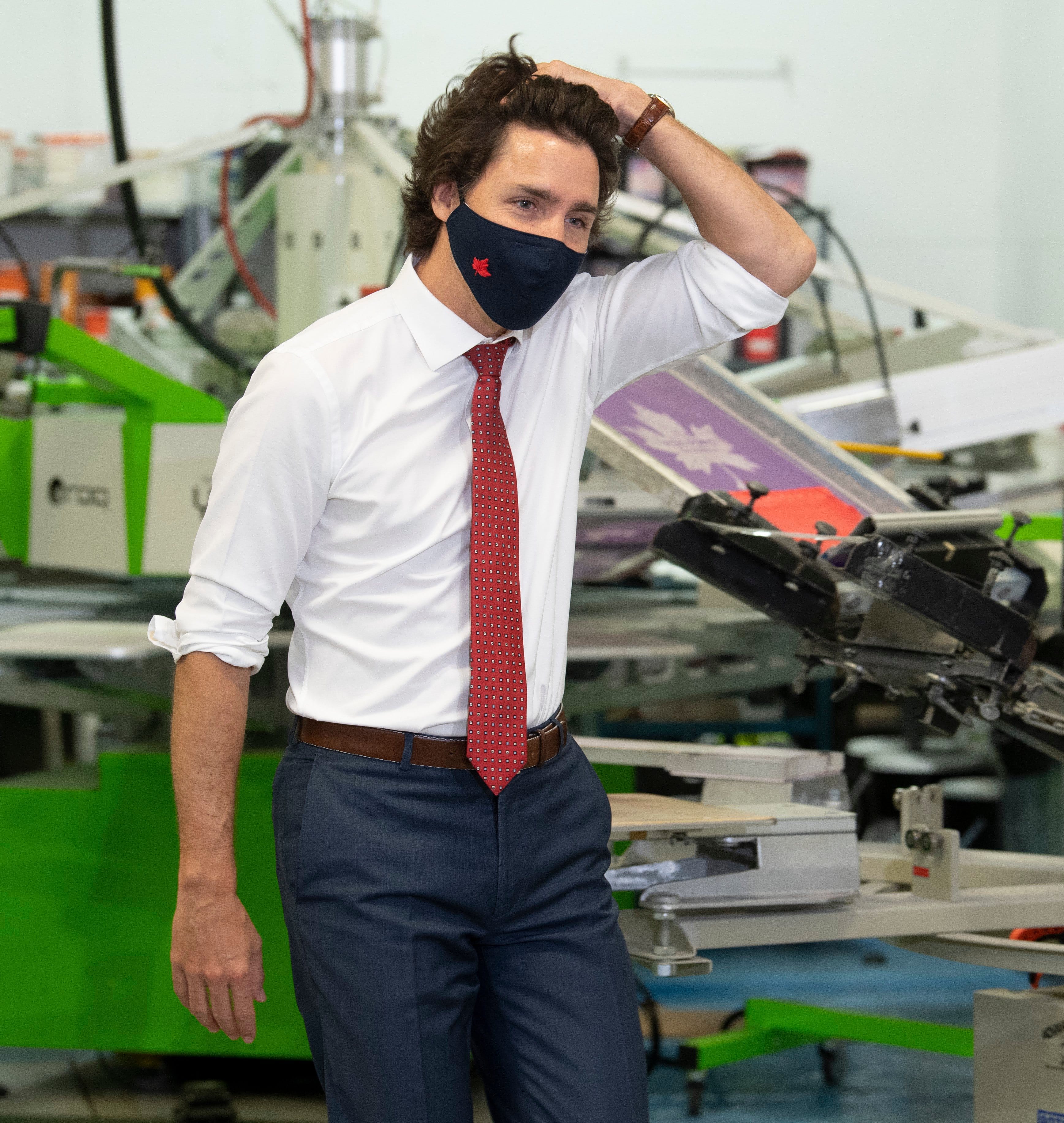 Prime Minister Justin Trudeau makes his way to the podium for a news conference after touring a business in Ottawa, Thursday June 11, 2020. (Adrian Wyld/CP)