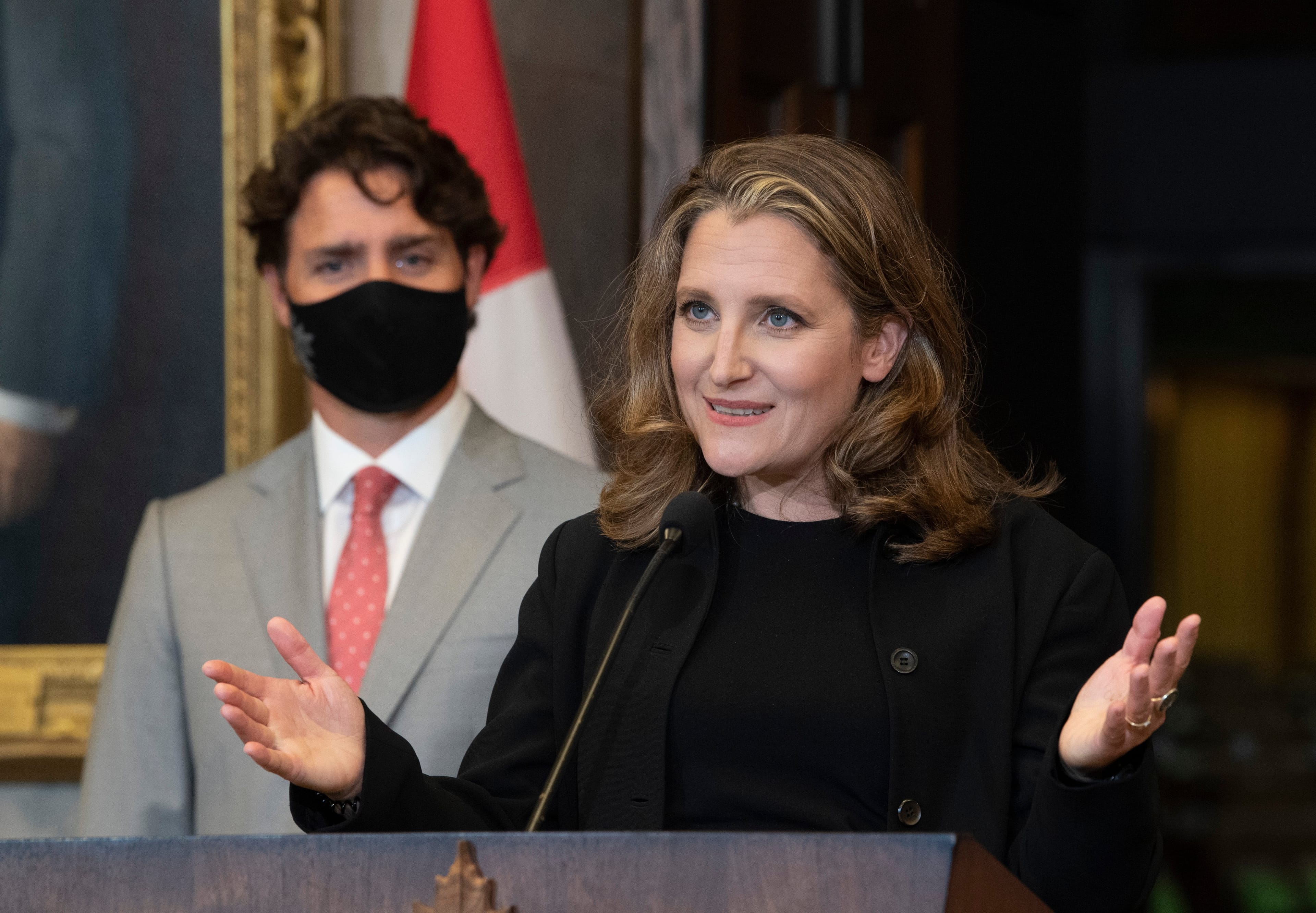 Prime Minister Justin Trudeau looks on as Deputy Prime Minister and Finance Minister Chrystia Freeland responds to a question during a news conference on Parliament Hill in Ottawa, Tuesday, Aug. 18, 2020. (Adrian Wyld/CP)