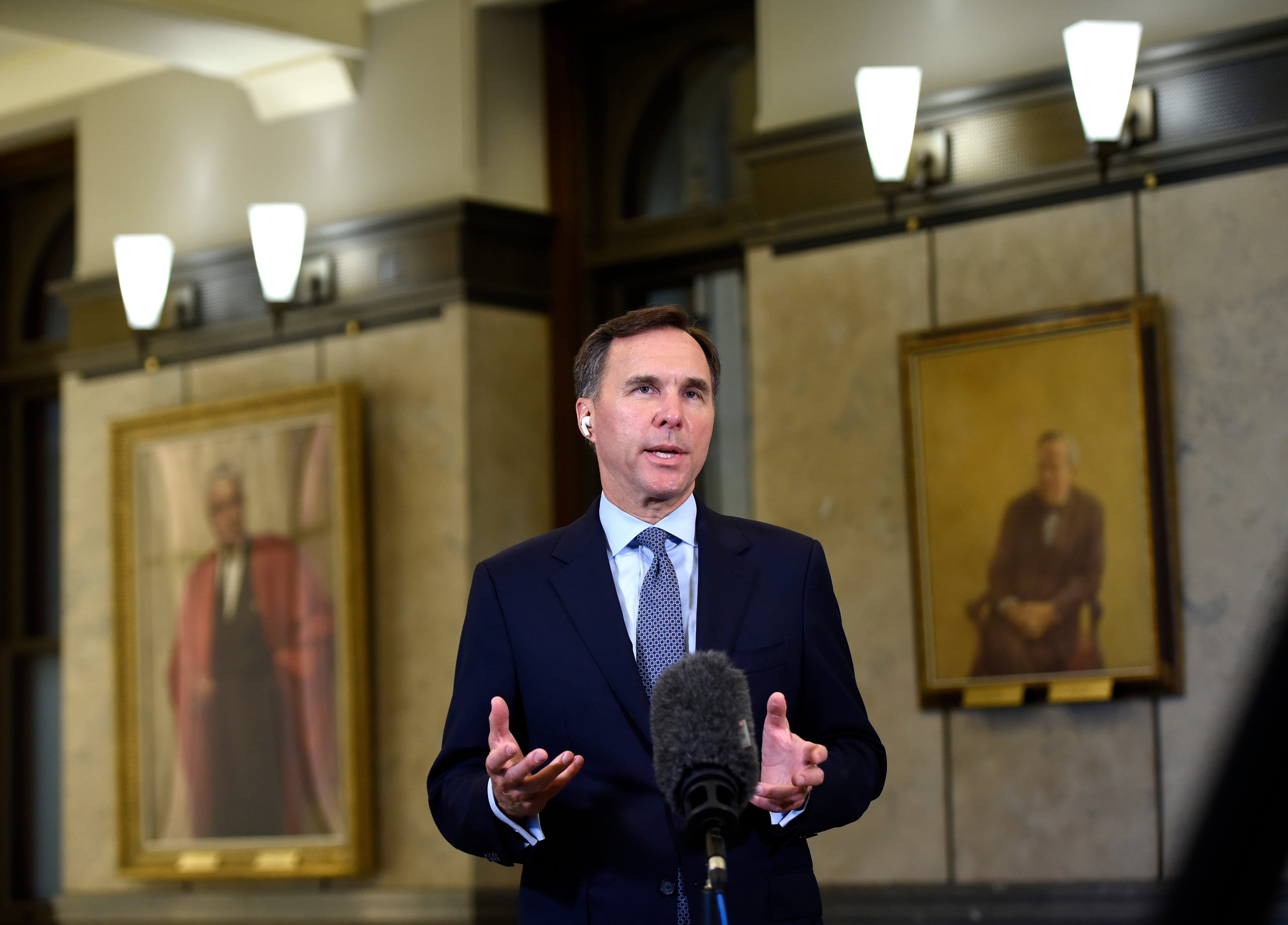 Minister of Finance Bill Morneau participates in a remote TV interview in the Foyer of the House of Commons on Parliament Hill, in Ottawa, on Wednesday, July 8, 2020. (Justin Tang/CP)