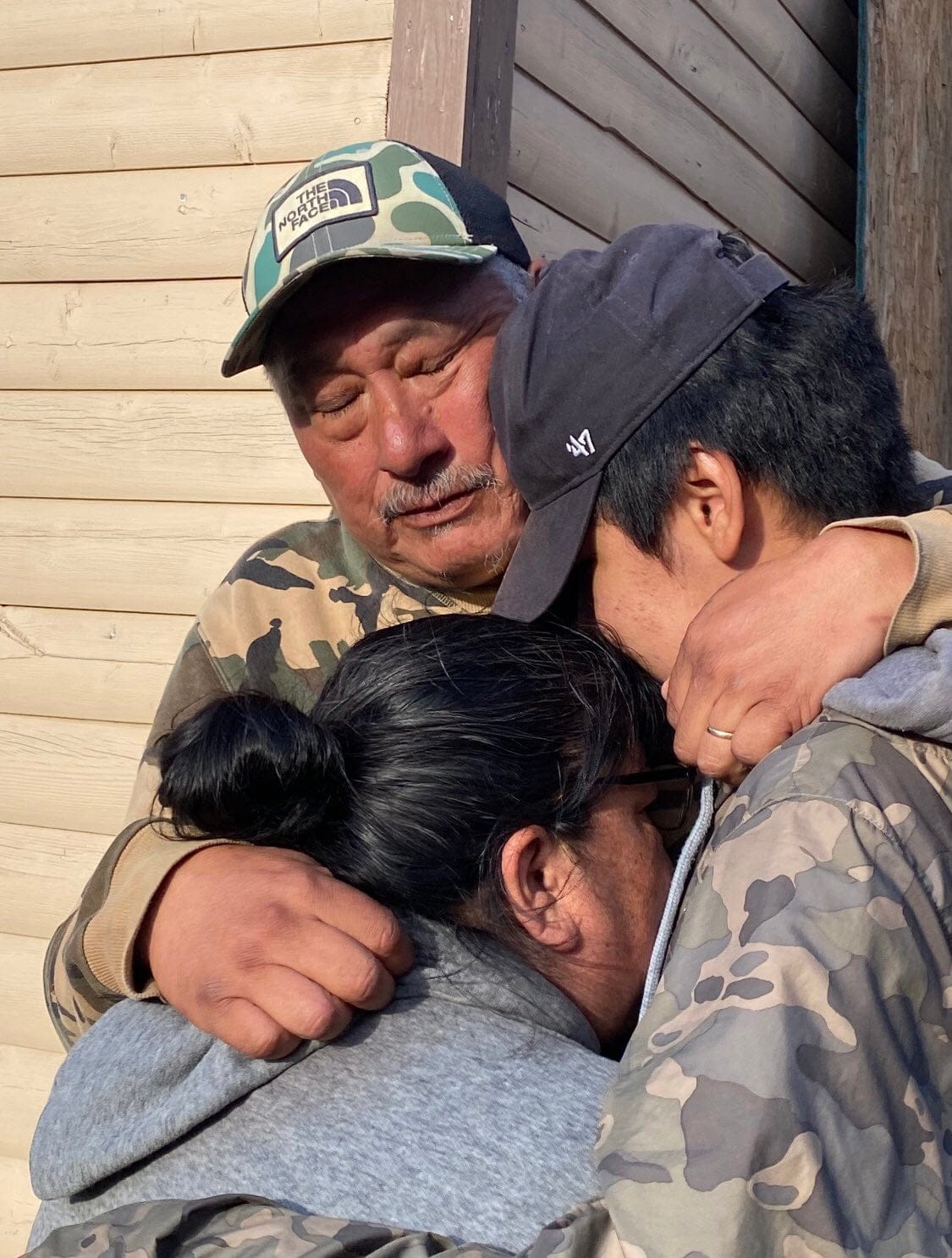 Sebastian (left) and Aries (right) Benuen embrace after making it home to Sheshatshiu after a 330-kilometre walk from Churchill Falls. (Courtesy of Sebastian Benuen)