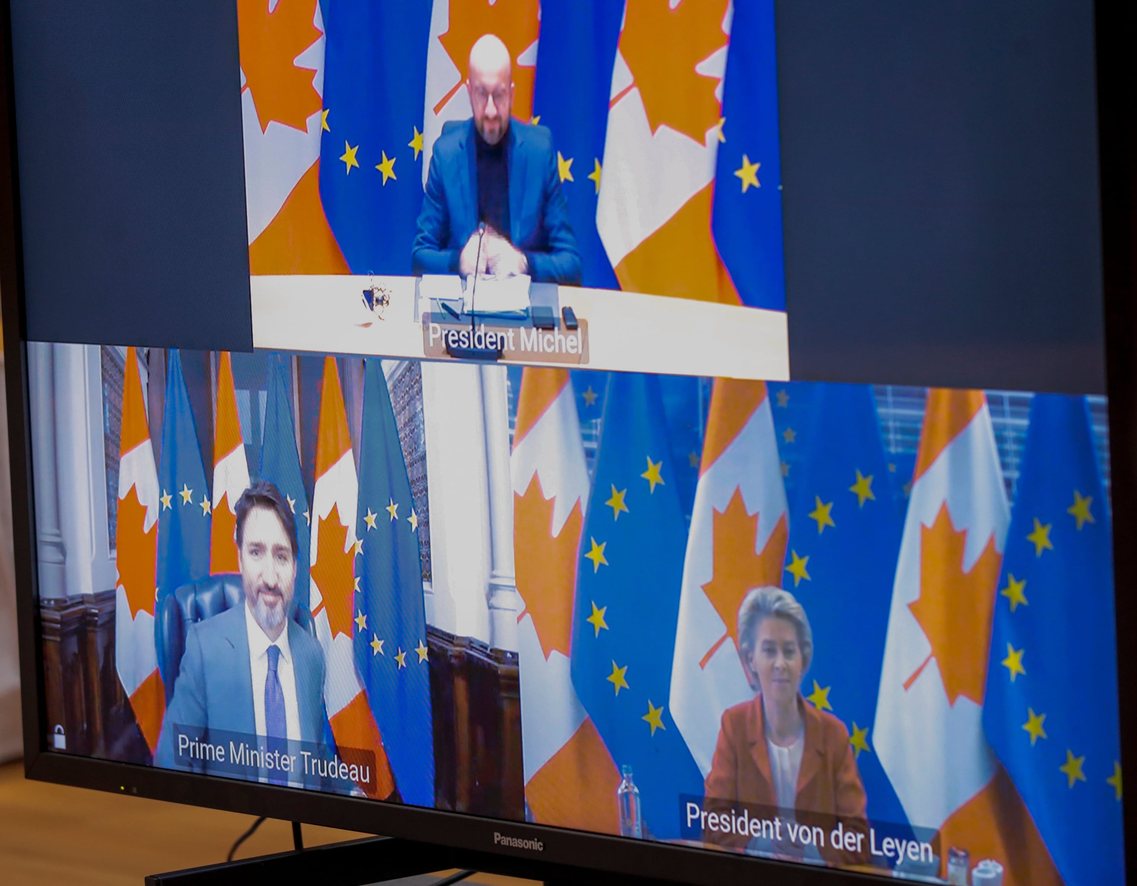 European Council President Charles Michel (Top), European Commission President Ursula Von Der Leyen and Prime Minister of Canada Justin Trudeau are seen on screens at the start of a virtual EU - Canada Summit in Brussels, Belgium, on Oct. 29 (Olivier Hoslet/EPA/CP)