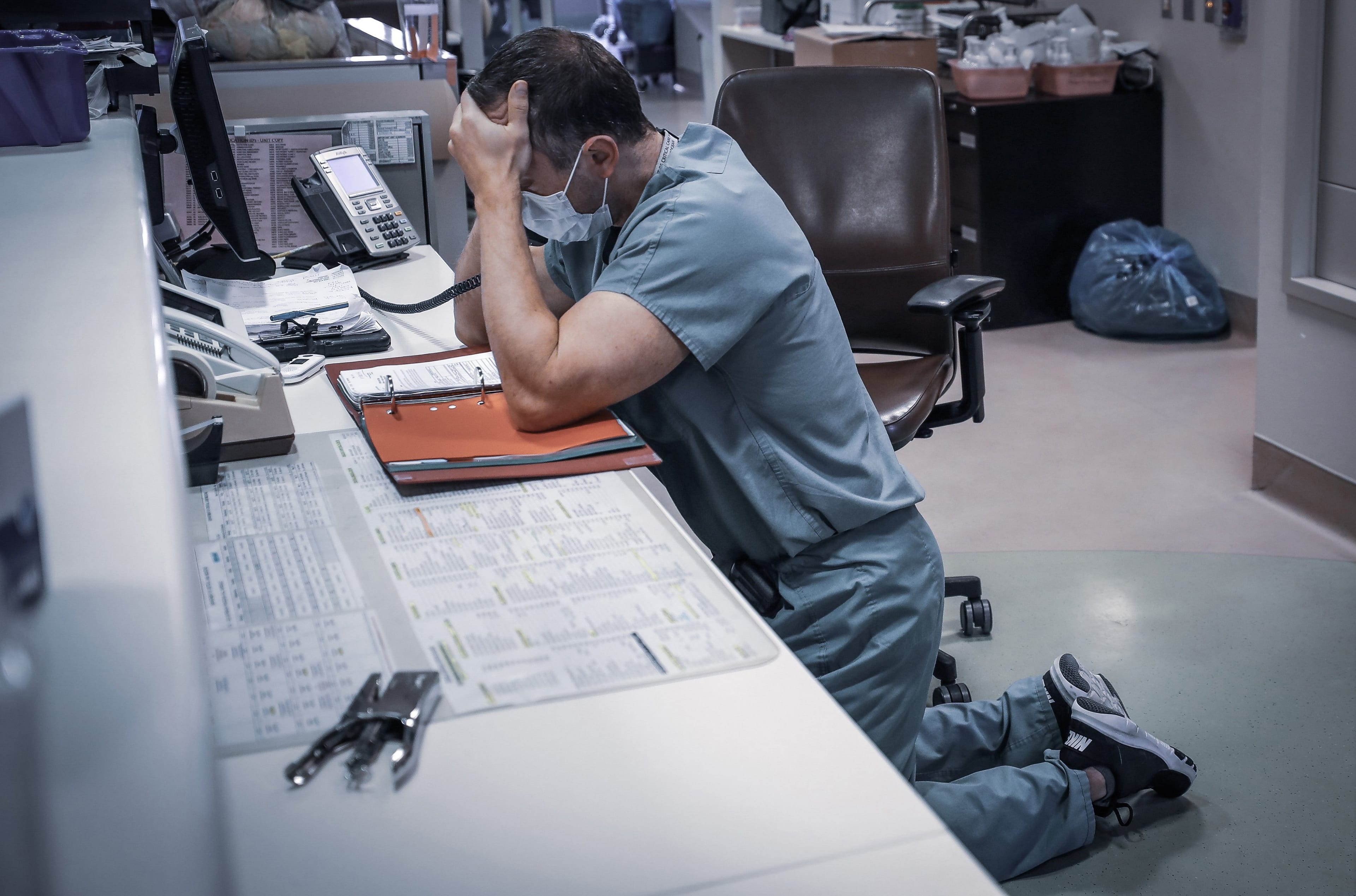 As of Friday, 462 people had died of COVID-19 in Alberta. In this picture, ICU physician Dr. Simon Demers-Marcil calls a family to tell them a loved one died of COVID-19. (Leah Hennel/@AHS_media/Twitter)