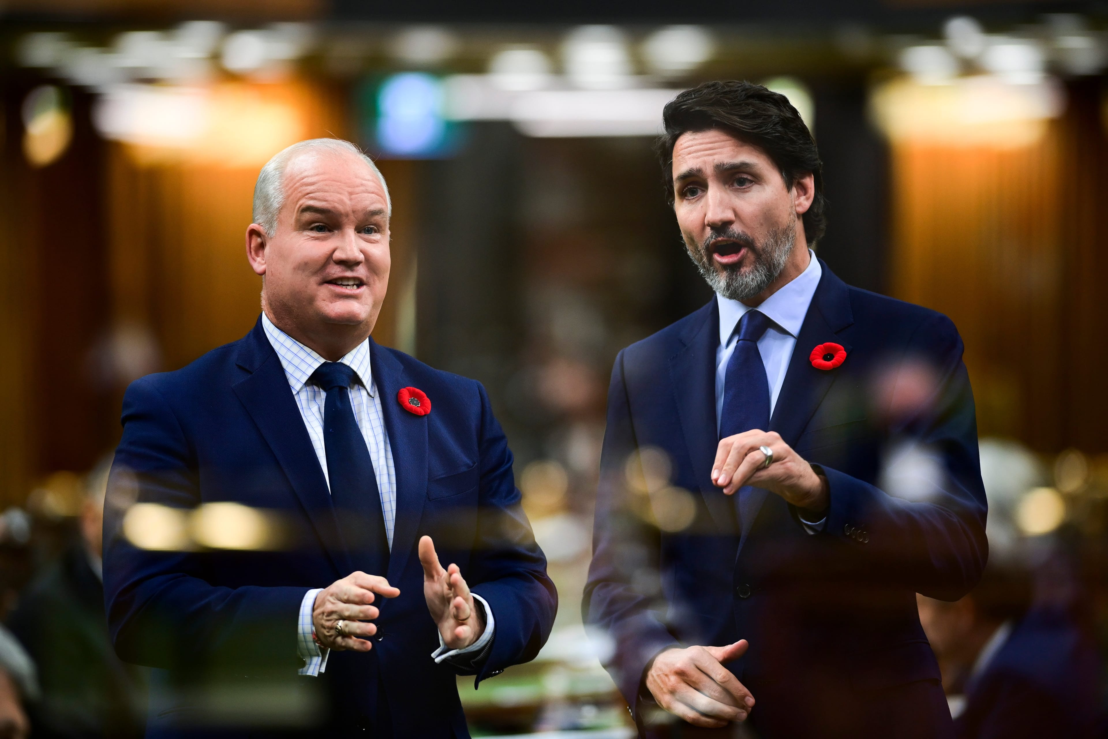 In the multiple-exposed image O'Toole asks a question and Trudeau answers during question period in the House of Commons on Nov. 4, 2020 (CP/Sean Kilpatrick)