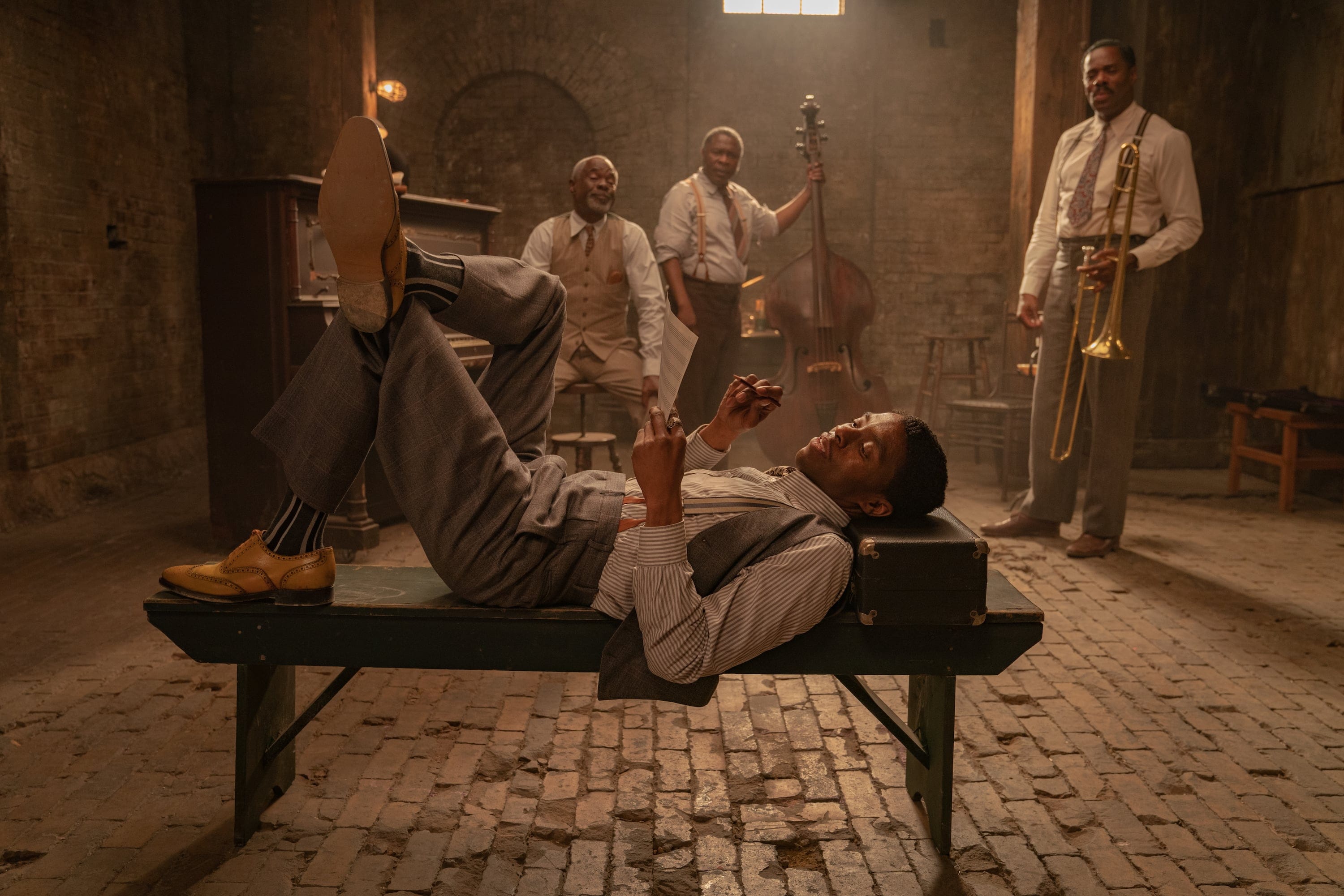Ma Rainey's Black Bottom (2020): (L to R) Chadwick Boseman as Levee, Glynn Turman as Toldeo, Michael Potts as Slow Drag, Colman Domingo as Cutler. Cr. David Lee / Netflix