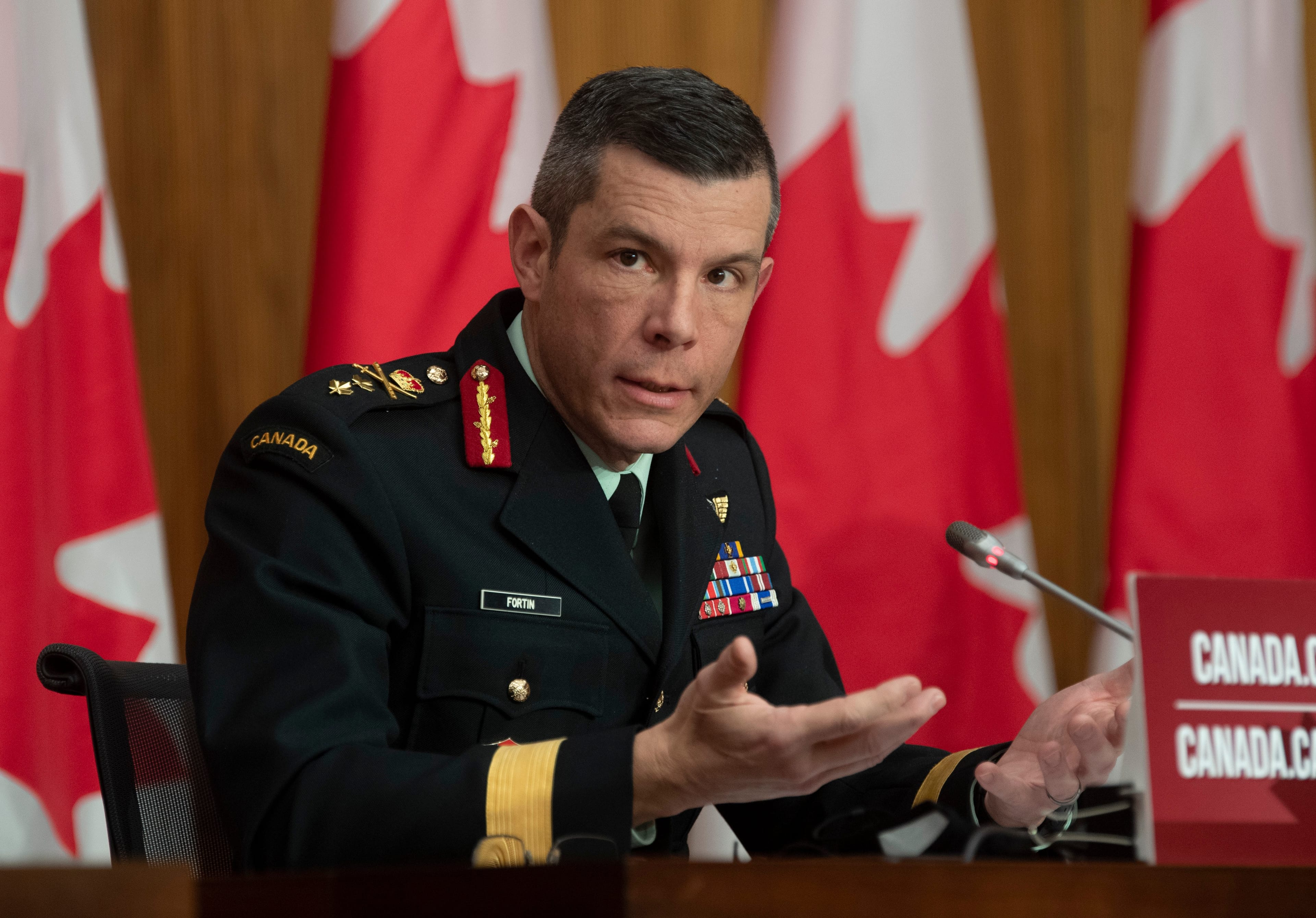 Major General Dany Fortin responds to a question during a news conference in Ottawa, Monday, Dec. 7, 2020. THE CANADIAN PRESS/Adrian Wyld