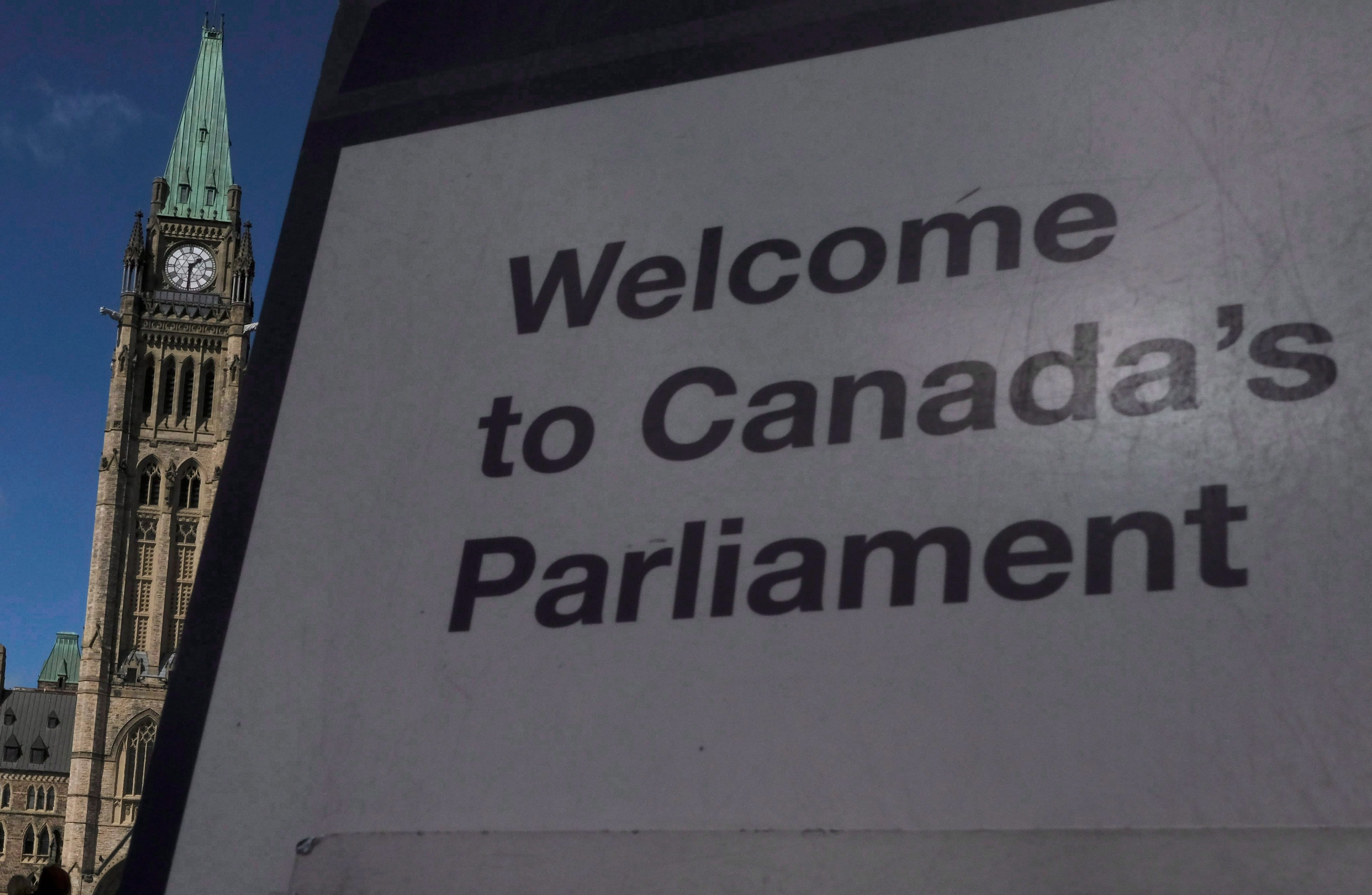 A sign greats visitors in front of the Peace Tower on Parliament Hill in Ottawa, on Sept. 17, 2018 (CP/Adrian Wyld)