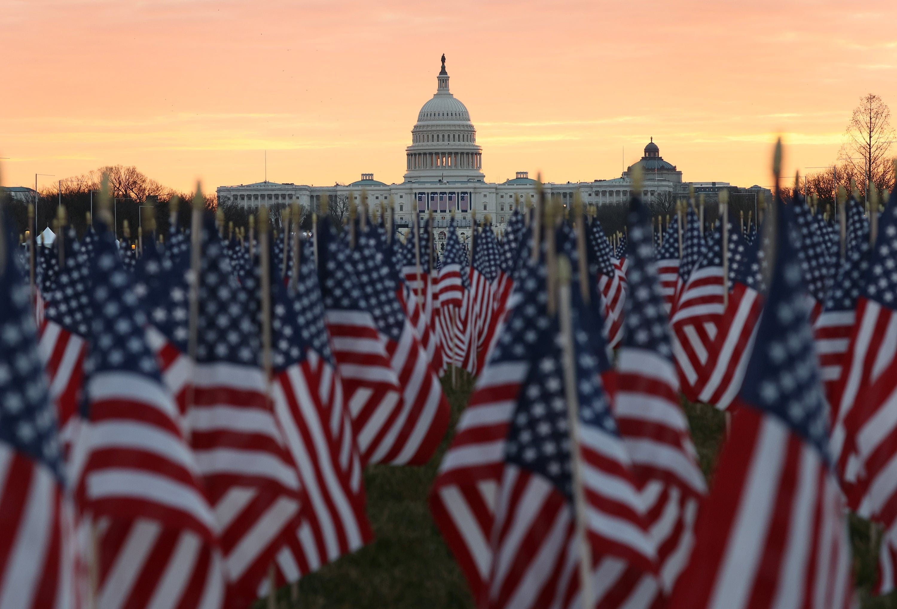 The U.S Capitol Building is prepared for the inaugural ceremonies for President-elect Joe Biden as American flags are placed in the ground on the National Mall on January 18, 2021 in Washington, DC. The approximately 191,500 U.S. flags will cover part of the National Mall and will represent the American people who are unable to travel to Washington, DC for the inauguration. (Joe Raedle/Getty Images)