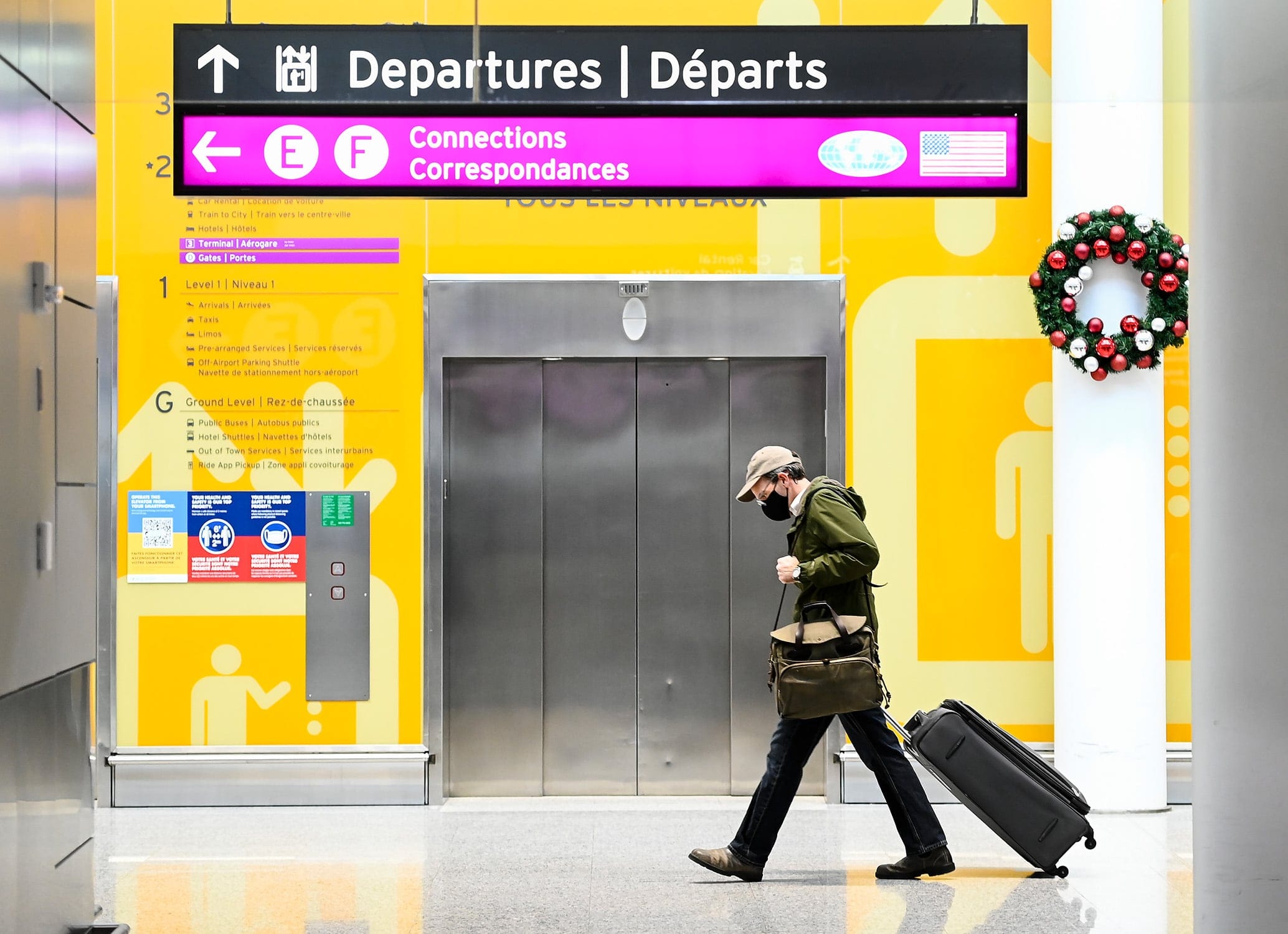 A man makes his way through Pearson International Airport during the COVID-19 pandemic in Toronto in December (Nathan Denette/CP)