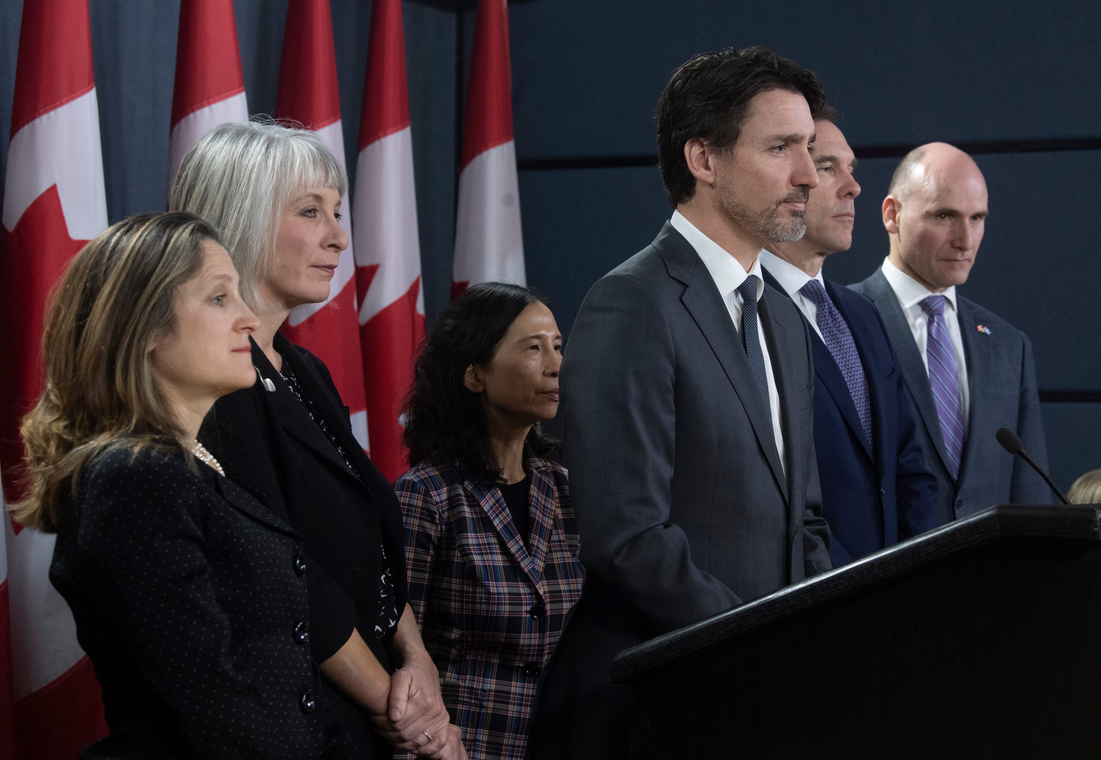 Prime Minister Justin Trudeau listens to a question with Deputy Prime Minister and Minister of Intergovernmental Affairs Chrystia Freeland, Minister of Health Patty Hajdu, Chief Medical Officer Theresa Tam, Minister of Finance Bill Morneau and President of the Treasury Board Jean-Yves Duclos during a news conference on the coronavirus situation, in Ottawa, March 11, 2020. (Adrian Wyld/CP)